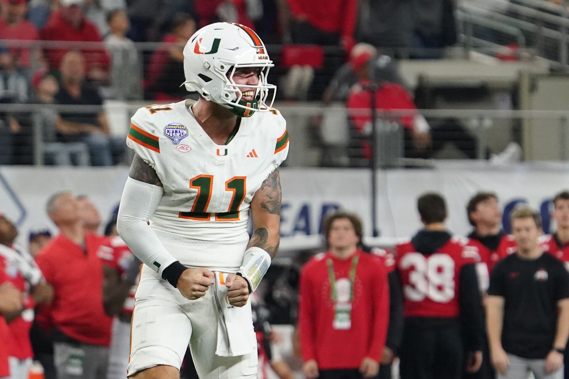 Miami Hurricanes quarterback Carson Beck (11) reads after a Miami touchdown against the Ohio State Buckeyes during second half the 2025 Cotton Bowl and quarterfinal game of the College Football Playoff at AT&T Stadium.