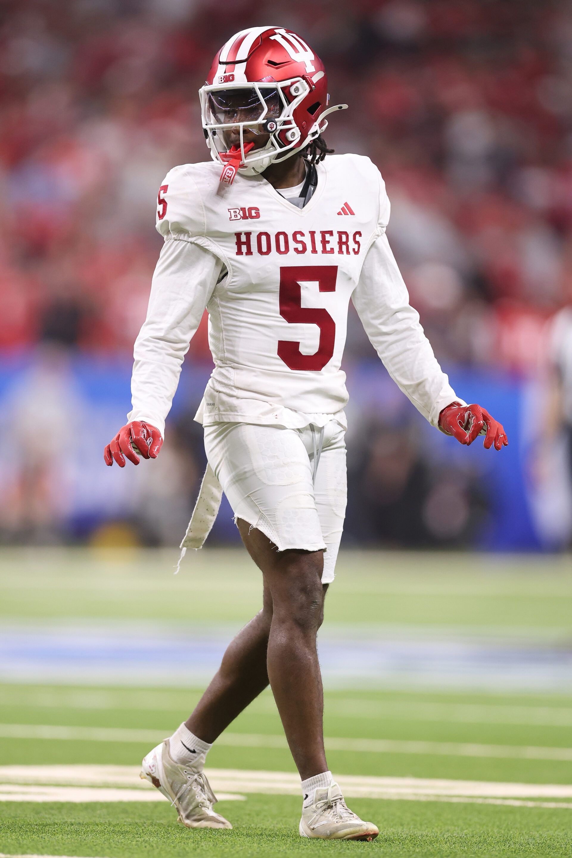 INDIANAPOLIS, INDIANA - DECEMBER 06: D'Angelo Ponds #5 of the Indiana Hoosiers in action against the Ohio State Buckeyes in the 2025 Big Ten Football Championship at Lucas Oil Stadium on December 06, 2025 in Indianapolis, Indiana.  (Photo by Michael Reaves/Getty Images)