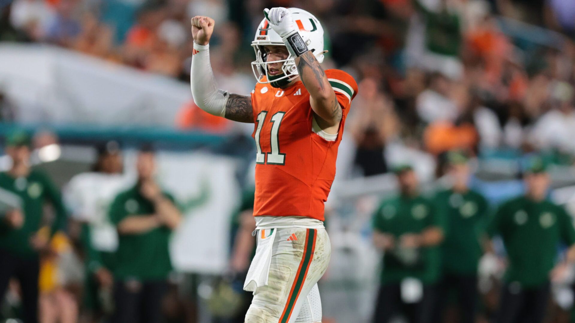 Miami Hurricanes quarterback Carson Beck (11) reacts against the South Florida Bulls during the third quarter at Hard Rock Stadium.