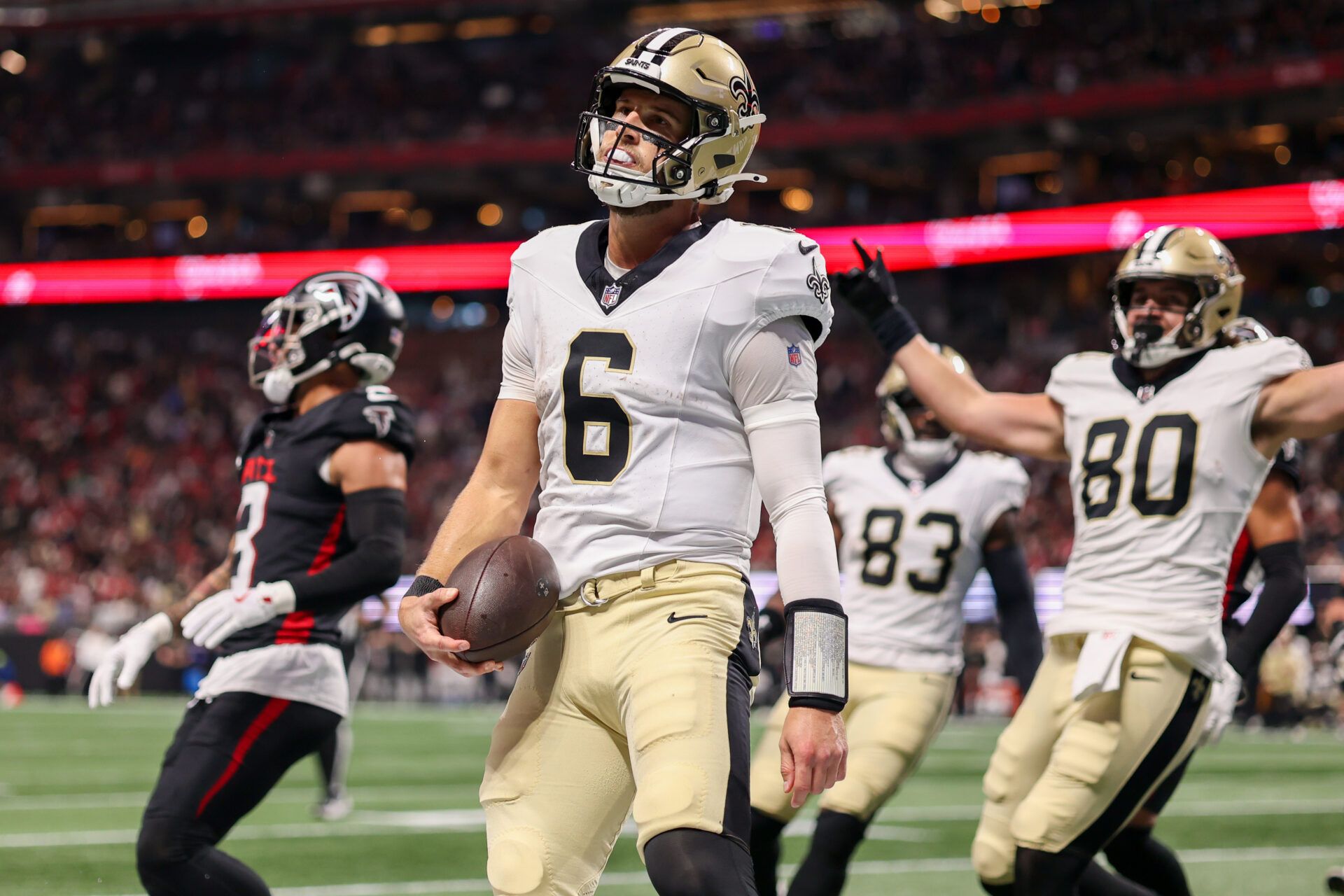 New Orleans Saints quarterback Tyler Shough (6) celebrates after a touchdown against the Atlanta Falcons in the second quarter at Mercedes-Benz Stadium.
