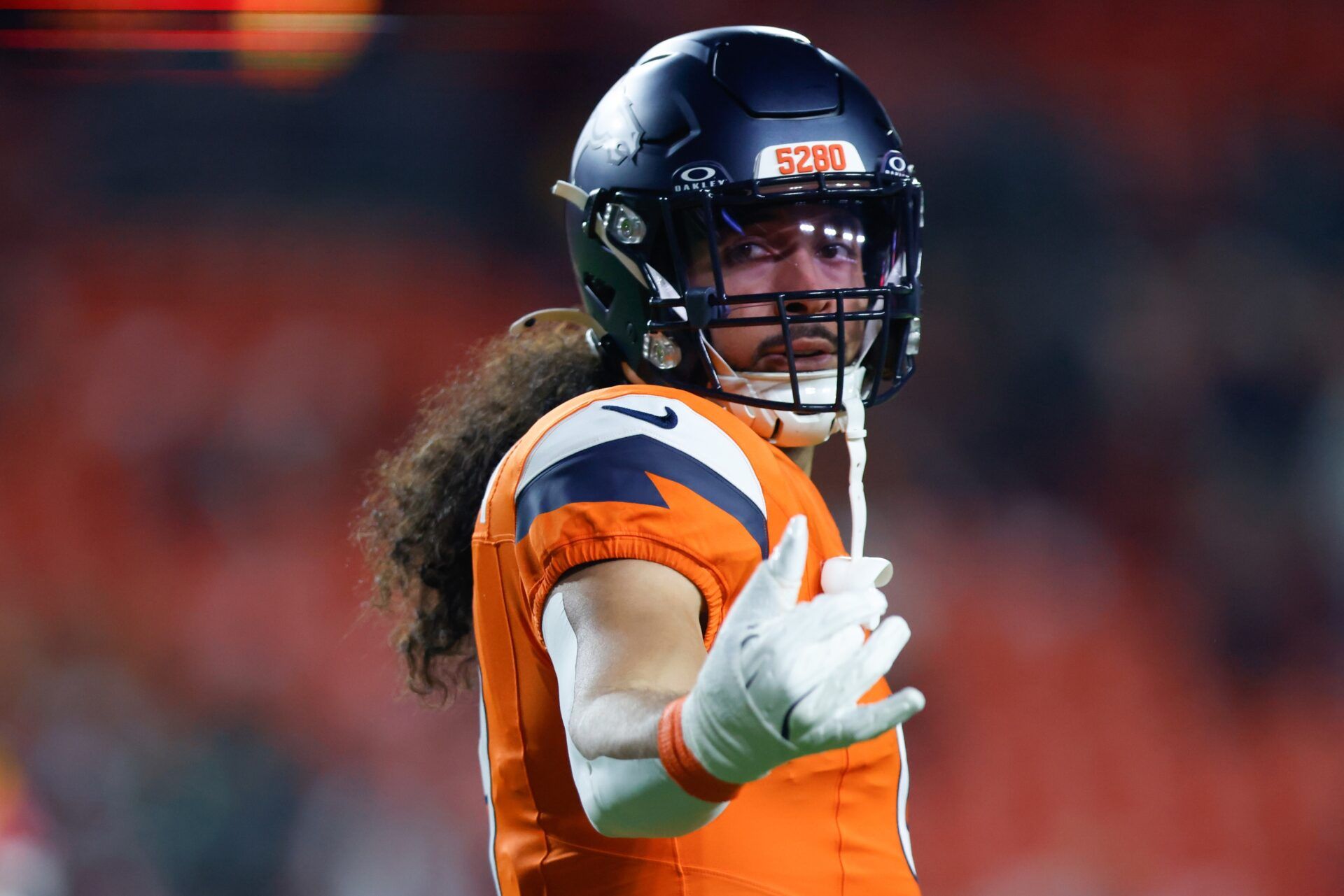 Denver Broncos safety Talanoa Hufanga (9) looks on during warmups prior to the game against the Washington Commanders at Northwest Stadium.