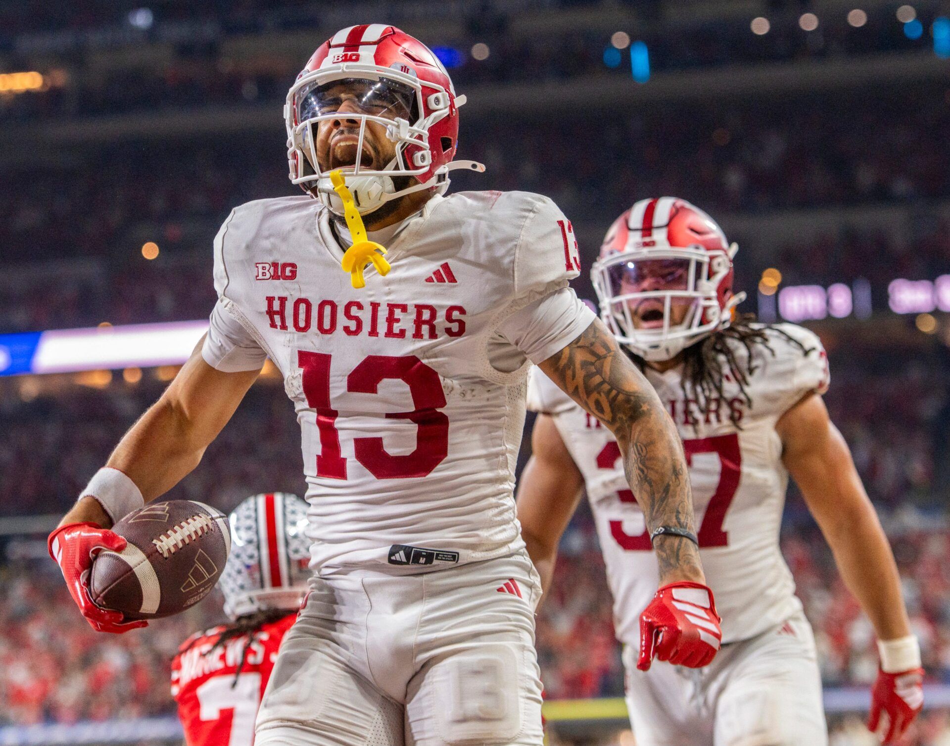 Indiana's Elijah Sarratt (13) celebrates a touchdown catch during the Indiana versus Ohio State Big Ten Championship football game at Lucas Oil Stadium on Saturday, Dec. 6, 2025.