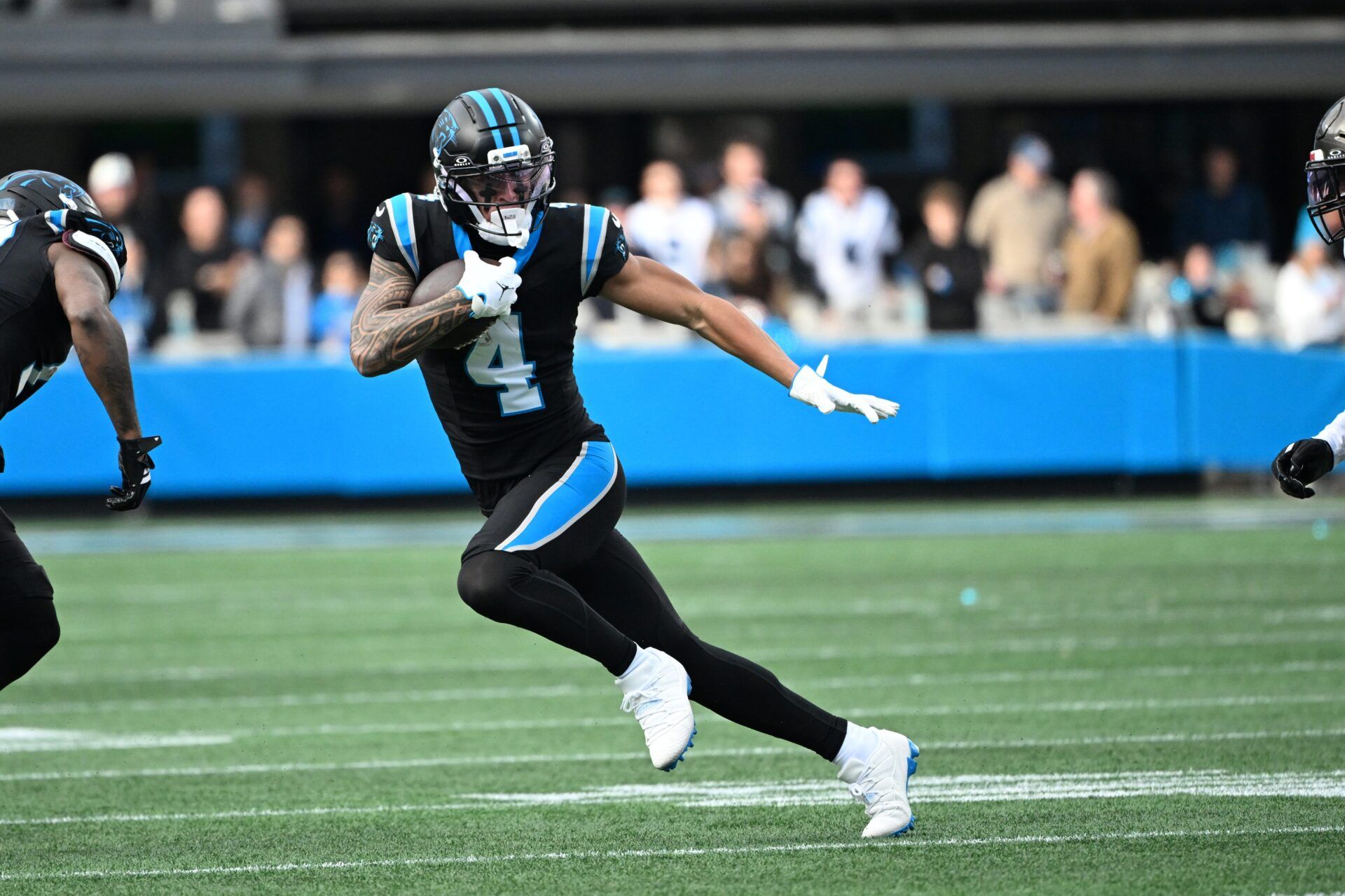 Carolina Panthers wide receiver Tetairoa McMillan (4) with the ball in the third quarter at Bank of America Stadium.