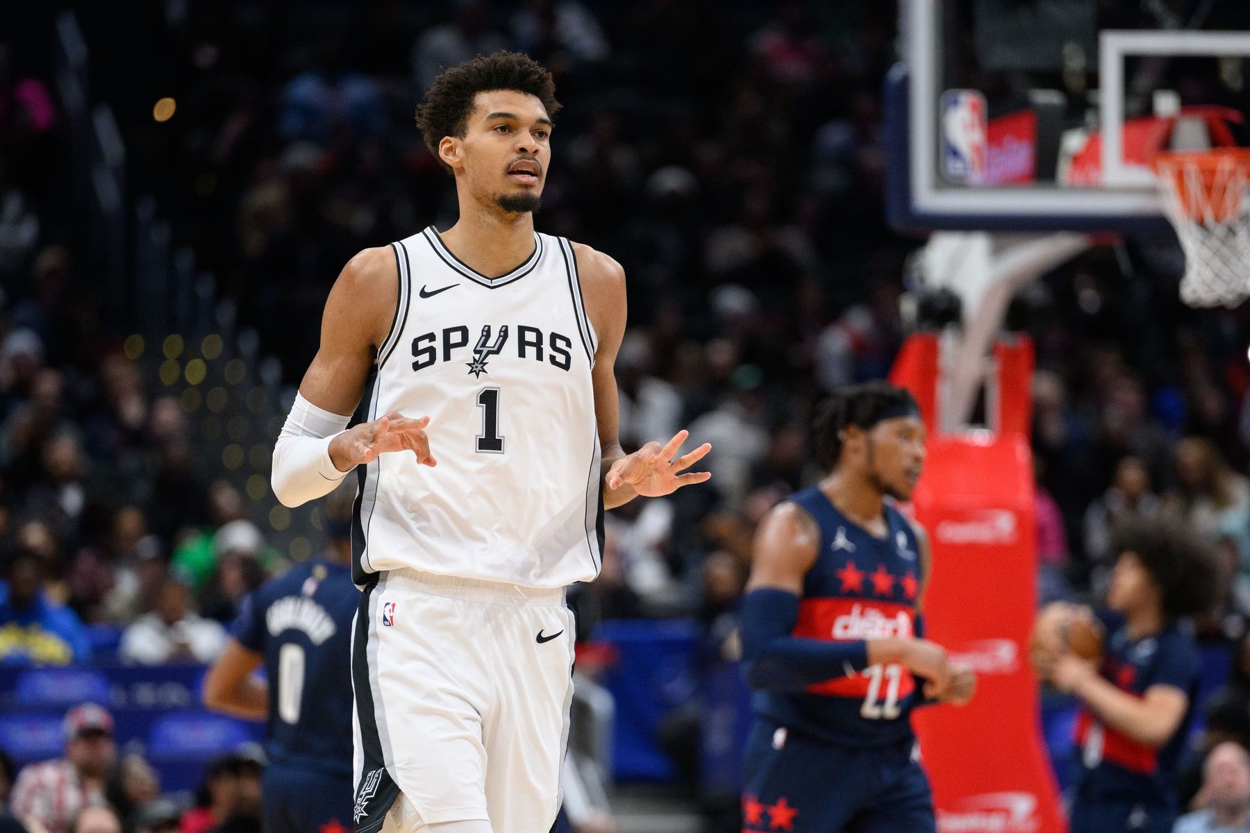 San Antonio Spurs center Victor Wembanyama (1) reacts after making a three point field goal during the first quarter against the Washington Wizards at Capital One Arena.