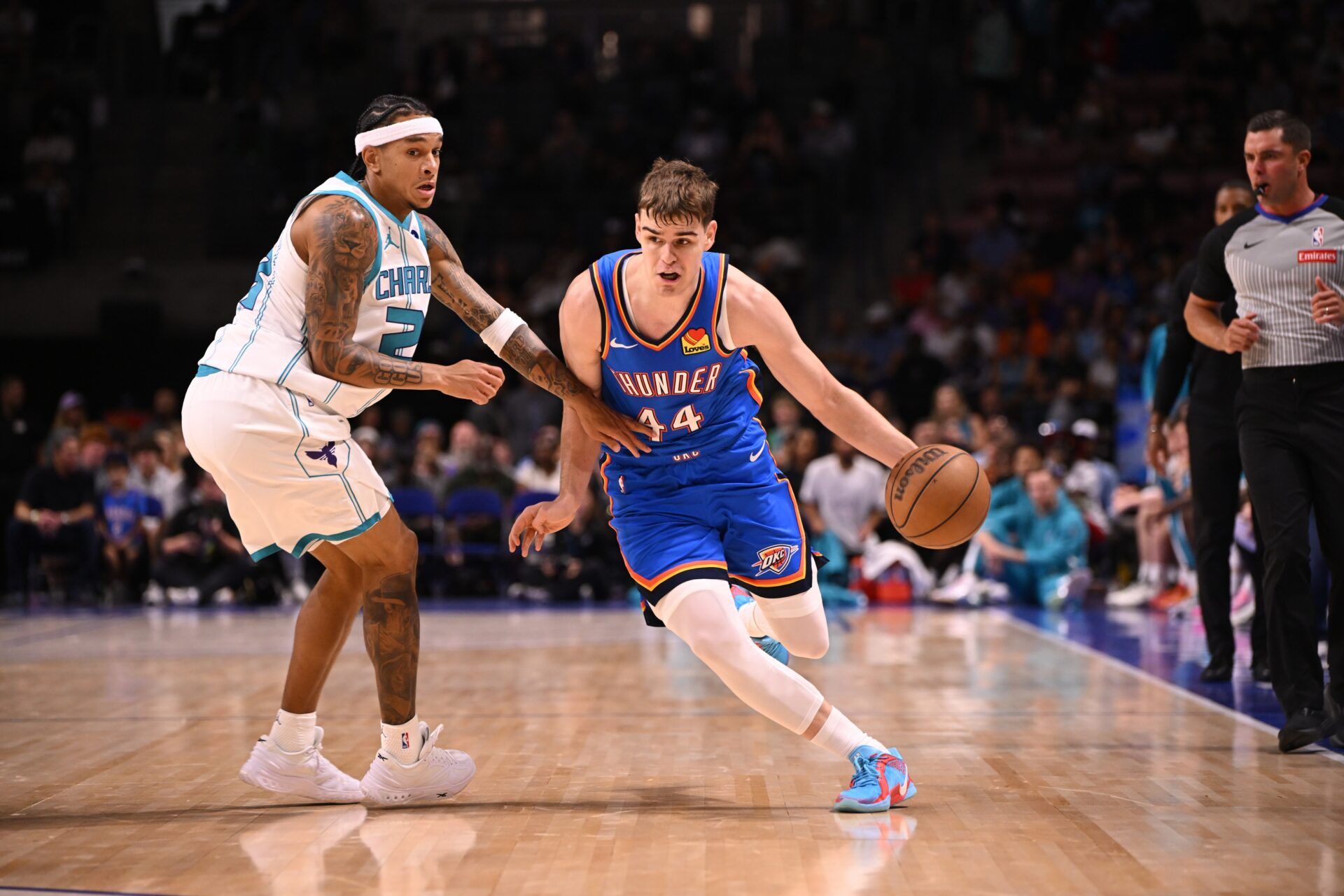 Oklahoma City Thunder guard Nikola Topic (44) drives up the court against the Charlotte Hornets in the first quarter at North Charleston Coliseum.