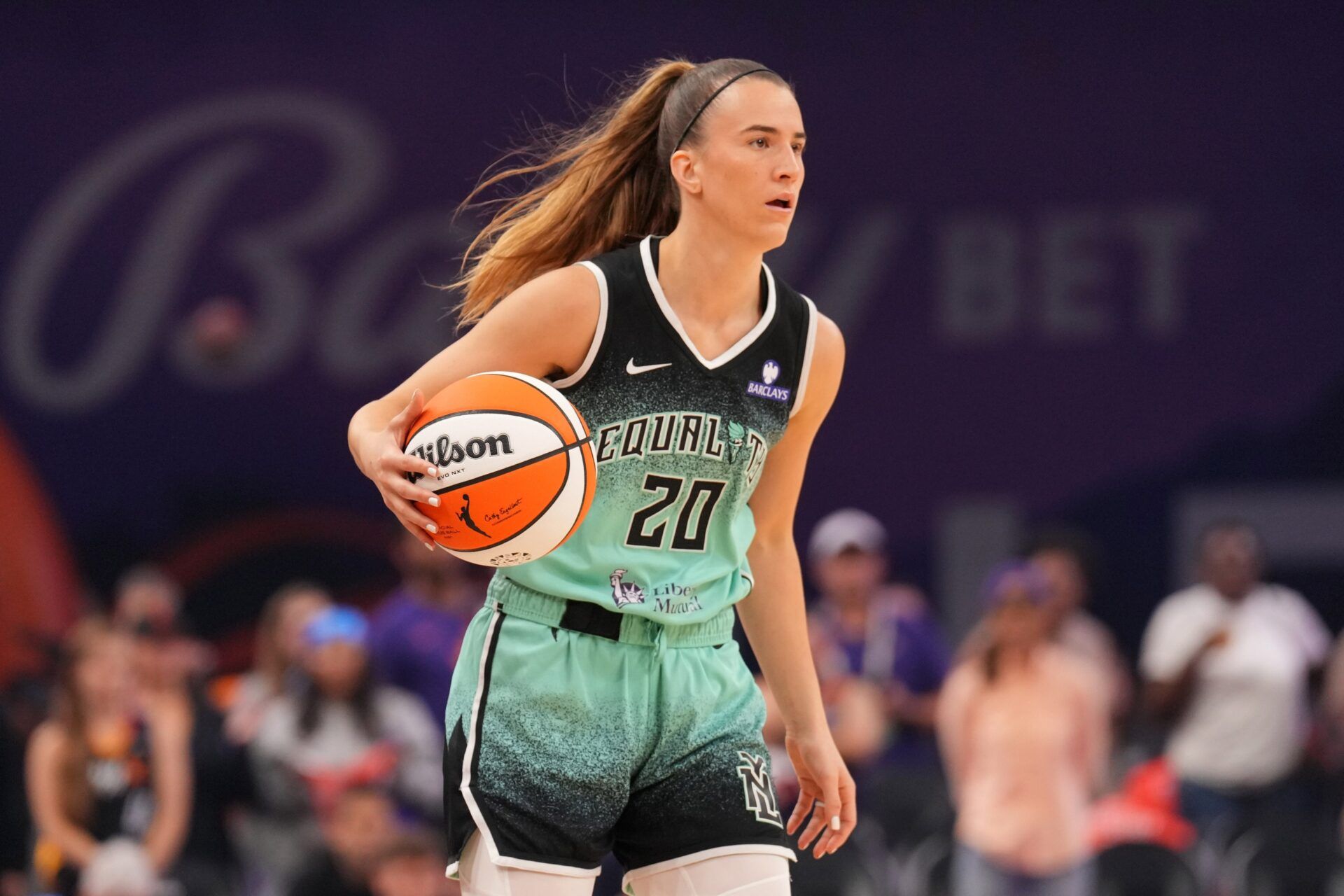 New York Liberty guard Sabrina Ionescu (20) dribbles against the Phoenix Mercury during the first half of game three of round one for the 2025 WNBA Playoffs at PHX Arena.