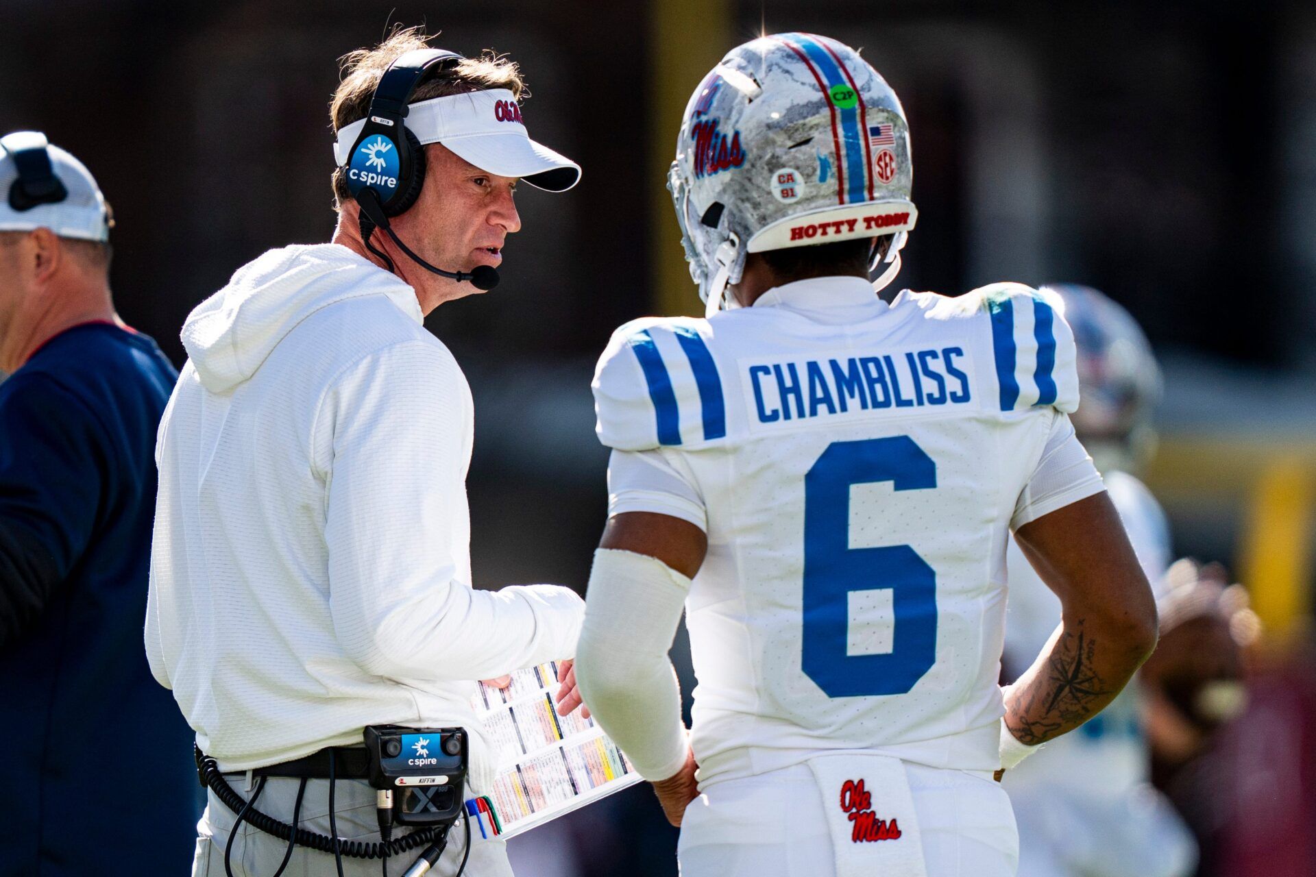 Ole Miss head coach Lane Kiffin talks with quarterback Trinidad Chambliss (6) during a college football game between Mississippi State and Ole Miss at Davis Wade Stadium in Starkville, Miss., on Friday, Nov. 28, 2025. Ole Miss defeated Mississippi State 38-19 in the Egg Bowl.