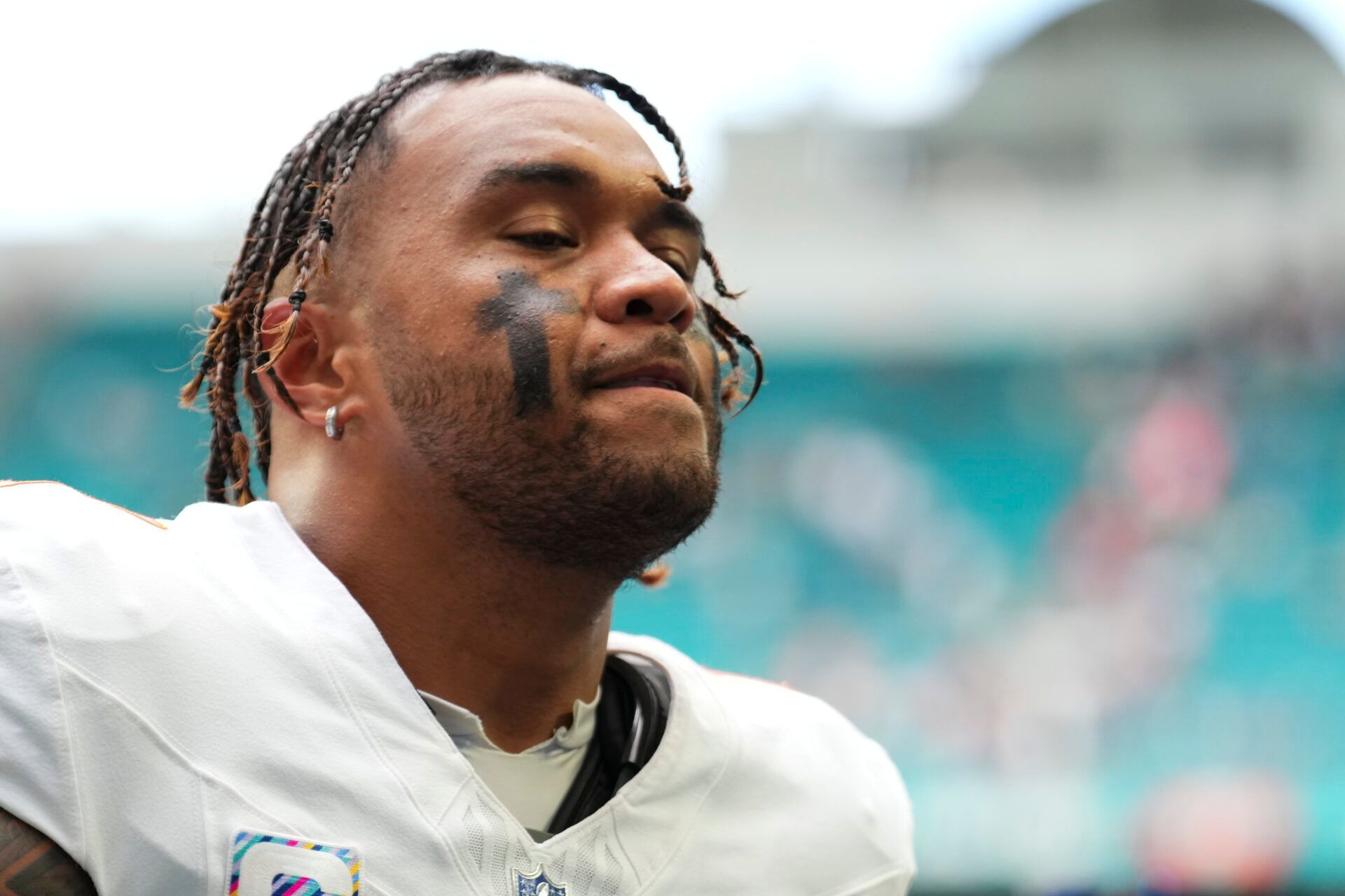 Miami Dolphins quarterback Tua Tagovailoa (1) leaves the field at the end of a game against the Los Angeles Chargers at Hard Rock Stadium.