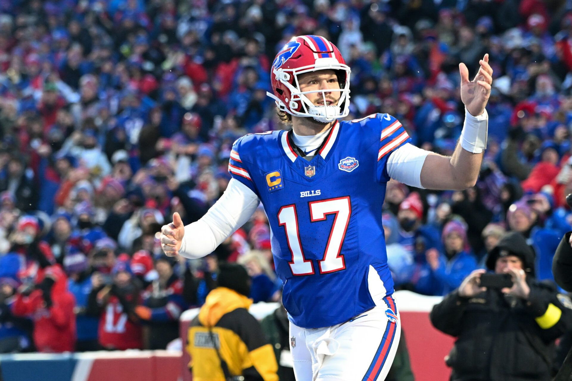 Buffalo Bills quarterback Josh Allen (17) runs onto the field before the game against the New York Jets at Highmark Stadium.