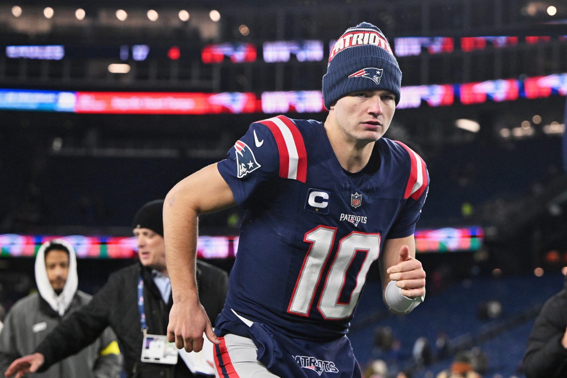 New England Patriots quarterback Drake Maye (10) runs off the field after the game against the Miami Dolphins at Gillette Stadium.