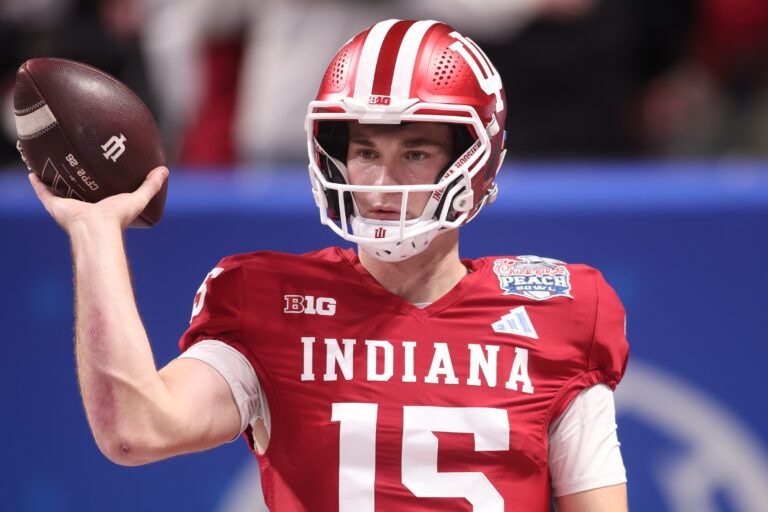Indiana Hoosiers quarterback Fernando Mendoza (15) warms up prior to the 2025 Peach Bowl and semifinal game of the College Football Playoff against the Oregon Ducks at Mercedes-Benz Stadium.