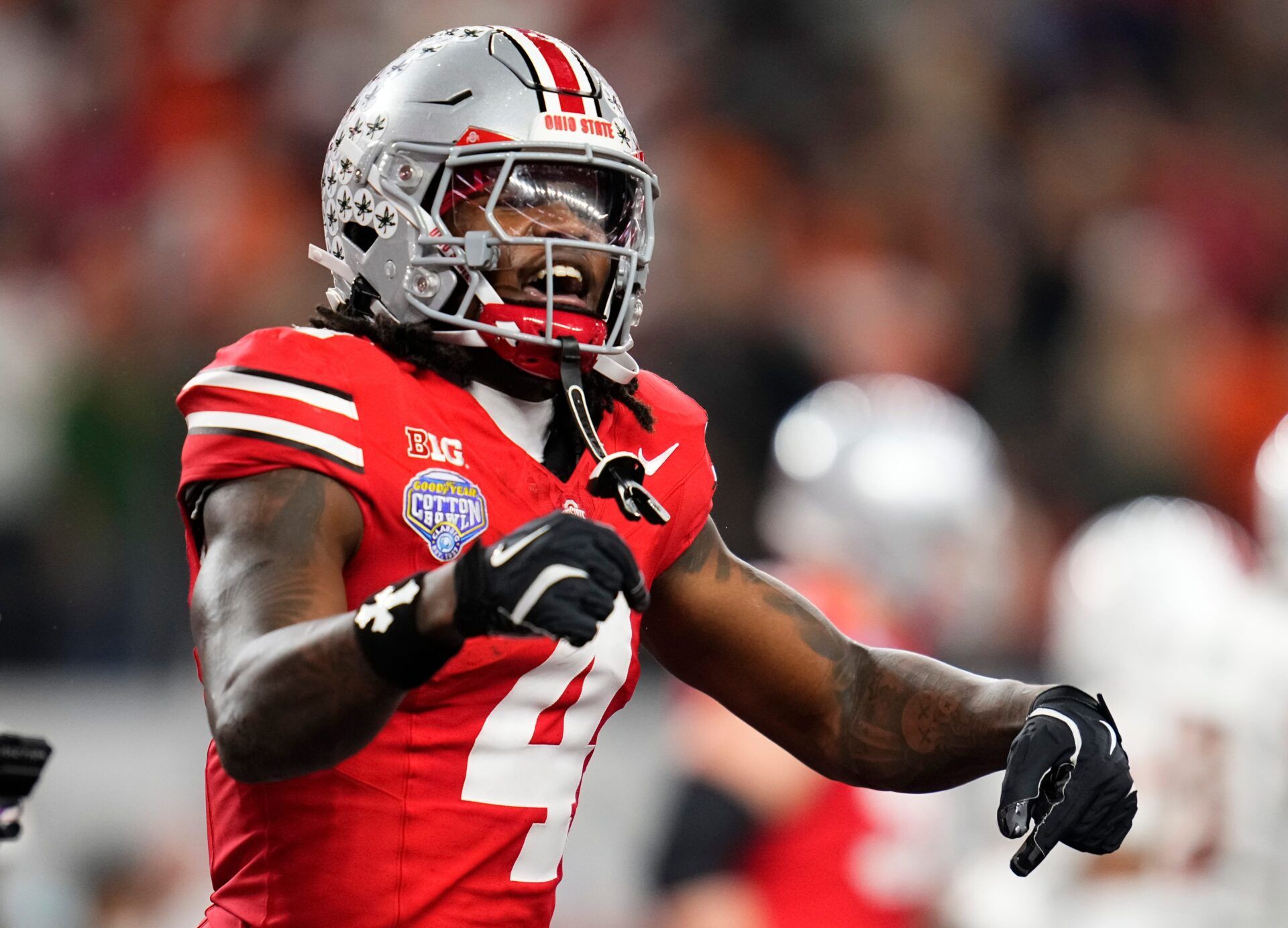 Ohio State Buckeyes wide receiver Jeremiah Smith (4) celebrates a touchdown during the Cotton Bowl at AT&T Stadium in Arlington, Texas for the College Football Playoff quarterfinal game against the Miami Hurricanes on Dec. 31, 2025. Ohio State lost 24-14.