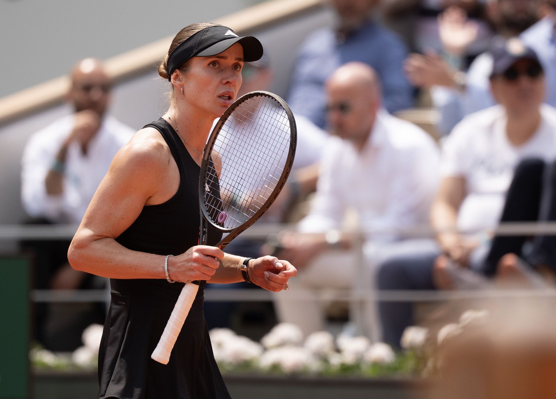 Elina Svitolina of Ukraine reacts to a point during her match against Iga Swiatek of Poland on day 10 at Roland Garros Stadium.