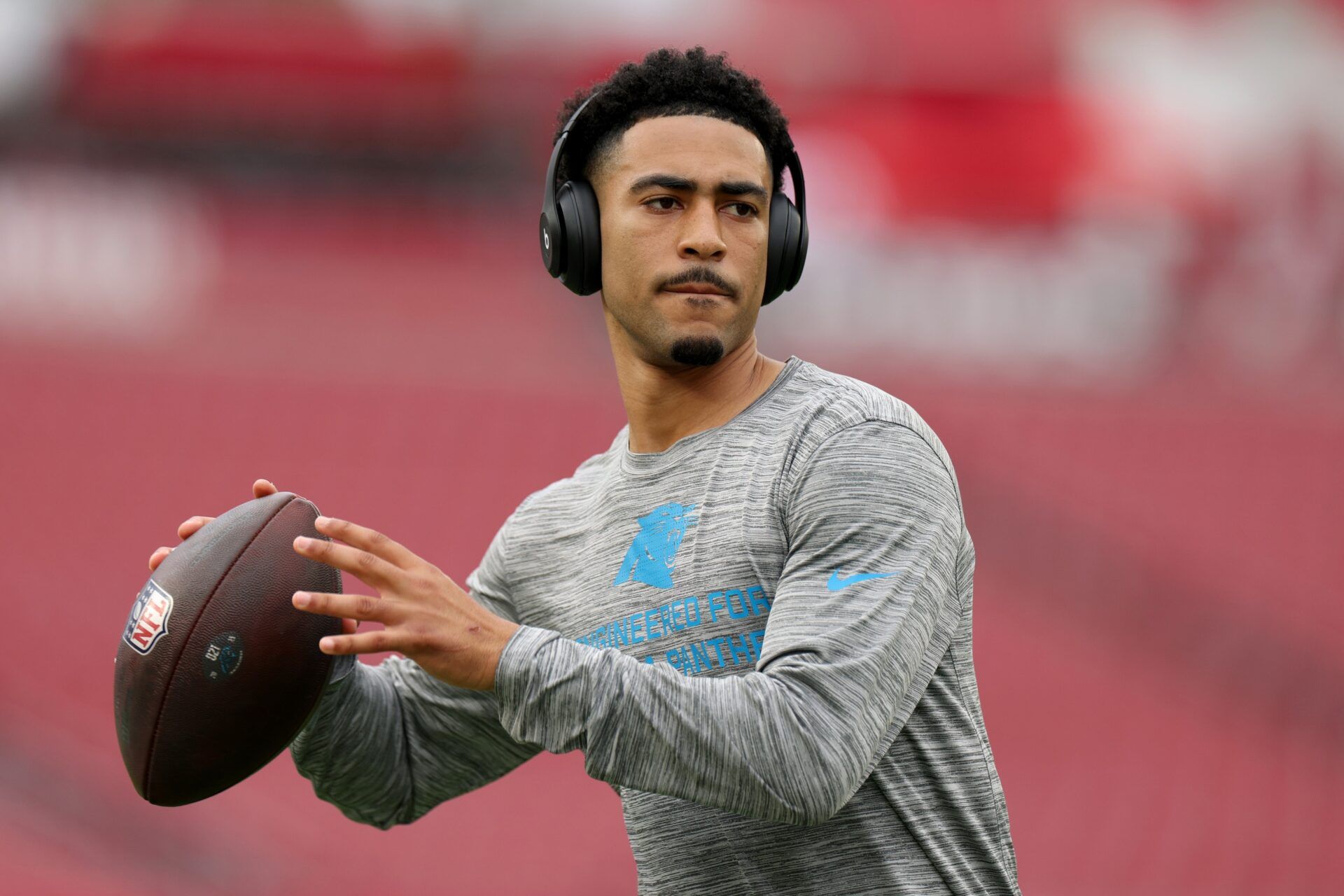 Carolina Panthers quarterback Bryce Young (9) warms up before the game against the Tampa Bay Buccaneers at Raymond James Stadium.