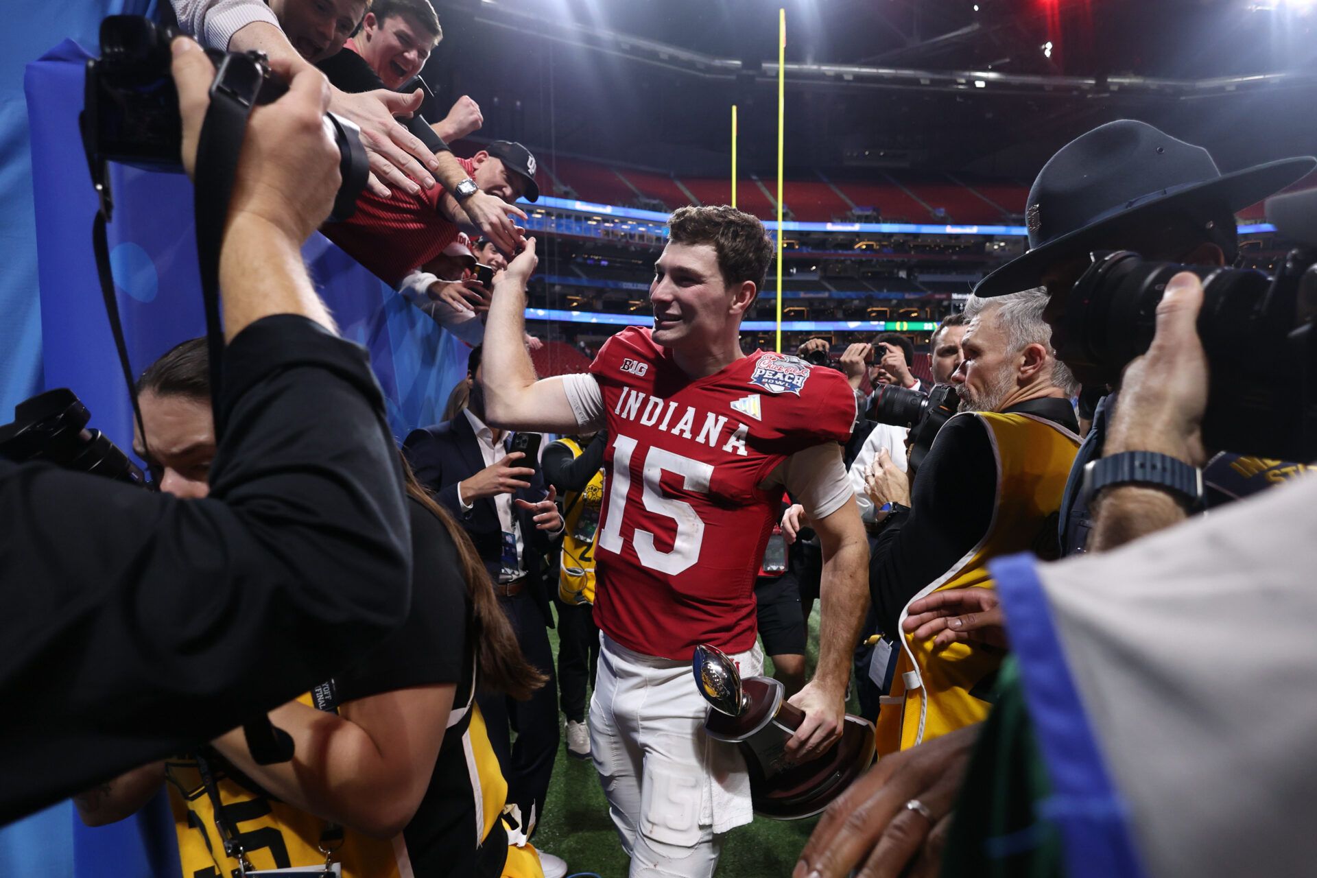 Indiana Hoosiers quarterback Fernando Mendoza (15) walks off the field after the 2025 Peach Bowl and semifinal game of the College Football Playoff at Mercedes-Benz Stadium.