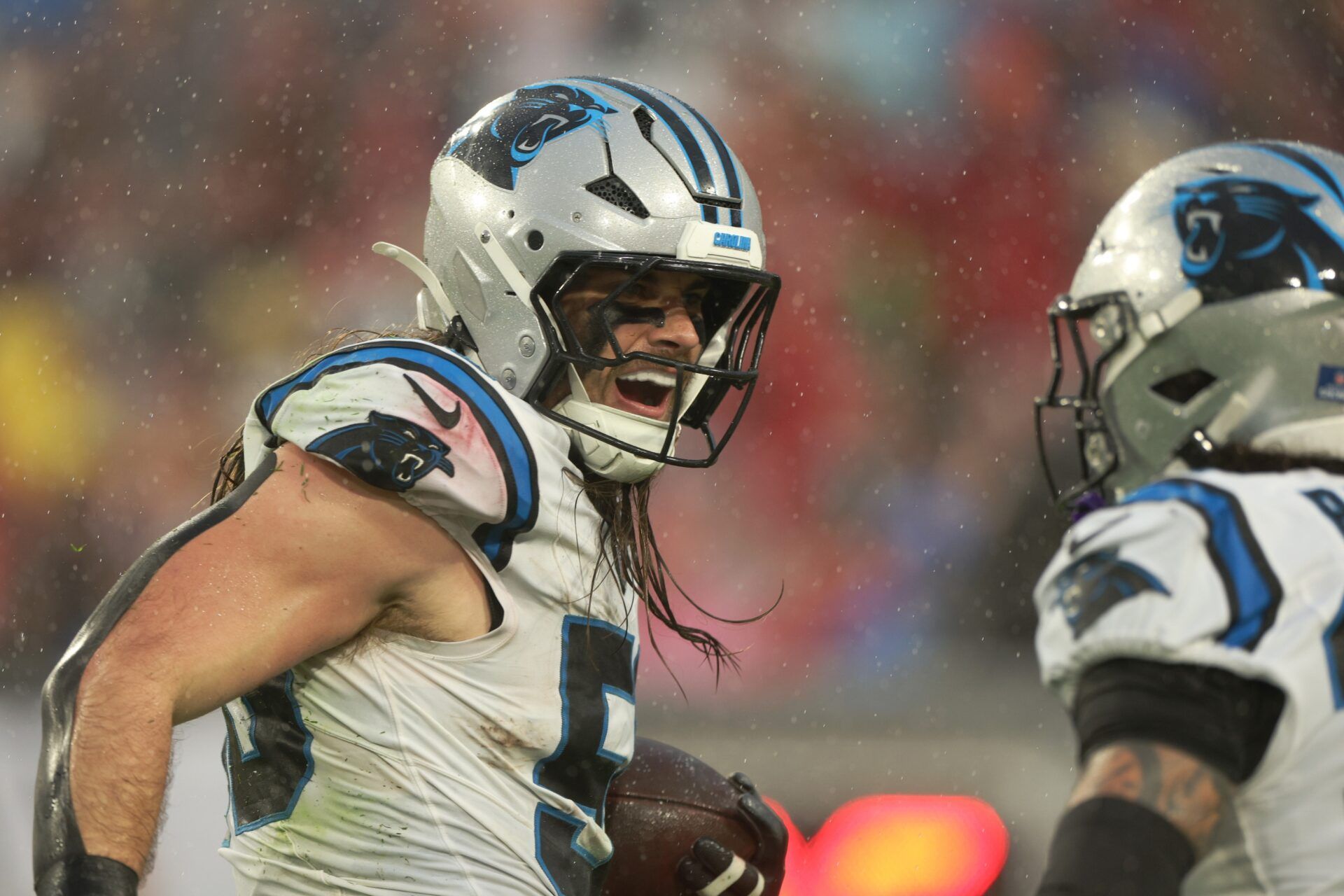 Carolina Panthers linebacker Christian Rozeboom (56) celebrates intercepting the ball against the Tampa Bay Buccaneers in the first half at Raymond James Stadium.