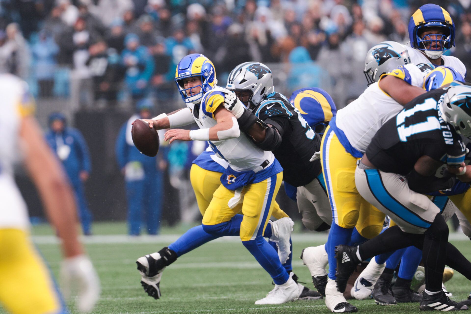 Los Angeles Rams quarterback Matthew Stafford (9) is sacked by Carolina Panthers defensive end Derrick Brown (95) during the fourth quarter at Bank of America Stadium.