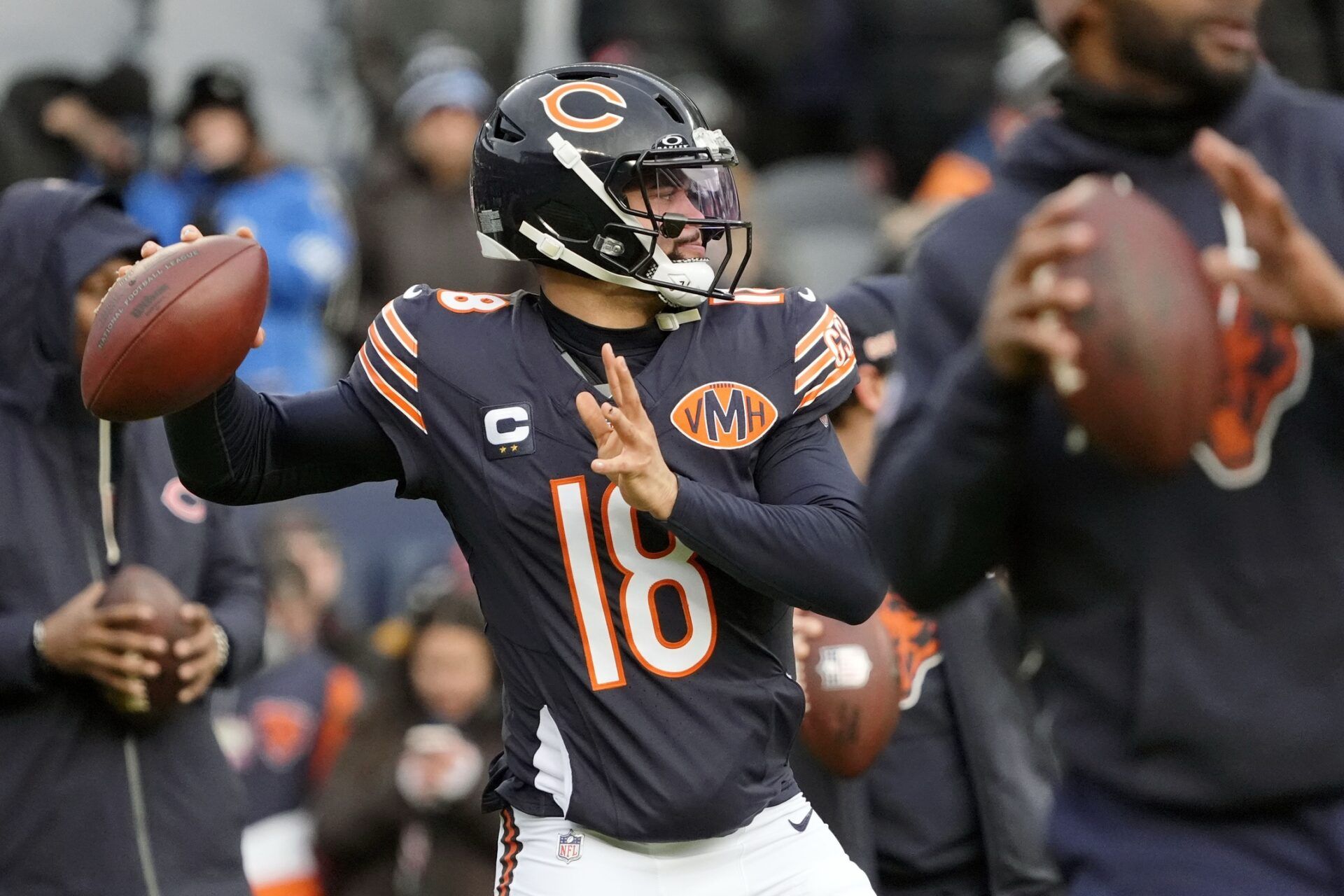 Chicago Bears quarterback Caleb Williams (18) warms up before the game between the Chicago Bears and the Detroit Lions at Soldier Field.