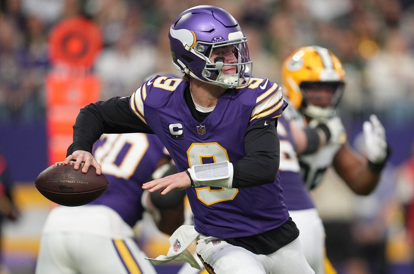 Minnesota Vikings quarterback J.J. McCarthy (9) throws a pass against the Green Bay Packers during the second quarter at U.S. Bank Stadium.