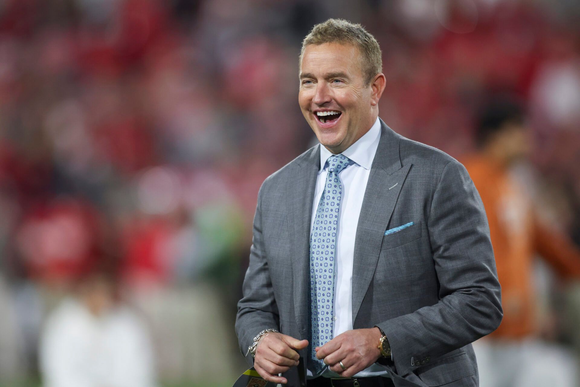 ESPN analyst Kirk Herbstreit smiles prior to a game between the Texas Longhorns and the Georgia Bulldogs at Sanford Stadium.