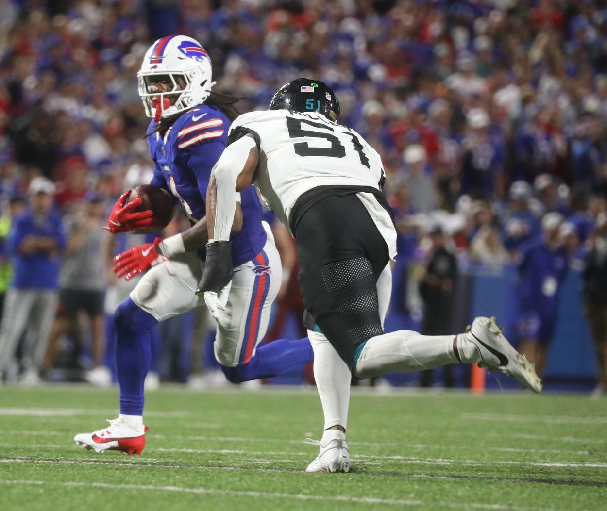 Bills James Cook gets a clear path to run before Jaguars Ventrell Miller catches him during the second half at Highmark Stadium in Orchard Park on Sept. 23, 2024.