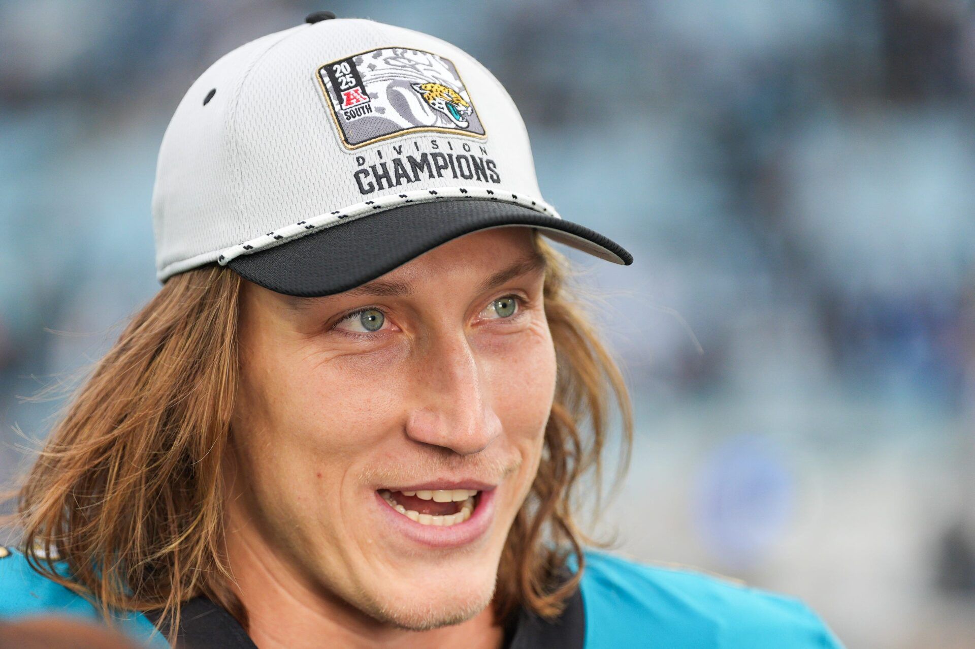 Jacksonville Jaguars quarterback Trevor Lawrence (16) proudly wears his AFC South Division Champions hat during the fourth quarter in an NFL football matchup at EverBank Stadium, Sunday, Jan. 4, 2026, in Jacksonville, Fla. The Jaguars defeated the Titans 41-7 [Doug Engle/Florida Times-Union]
