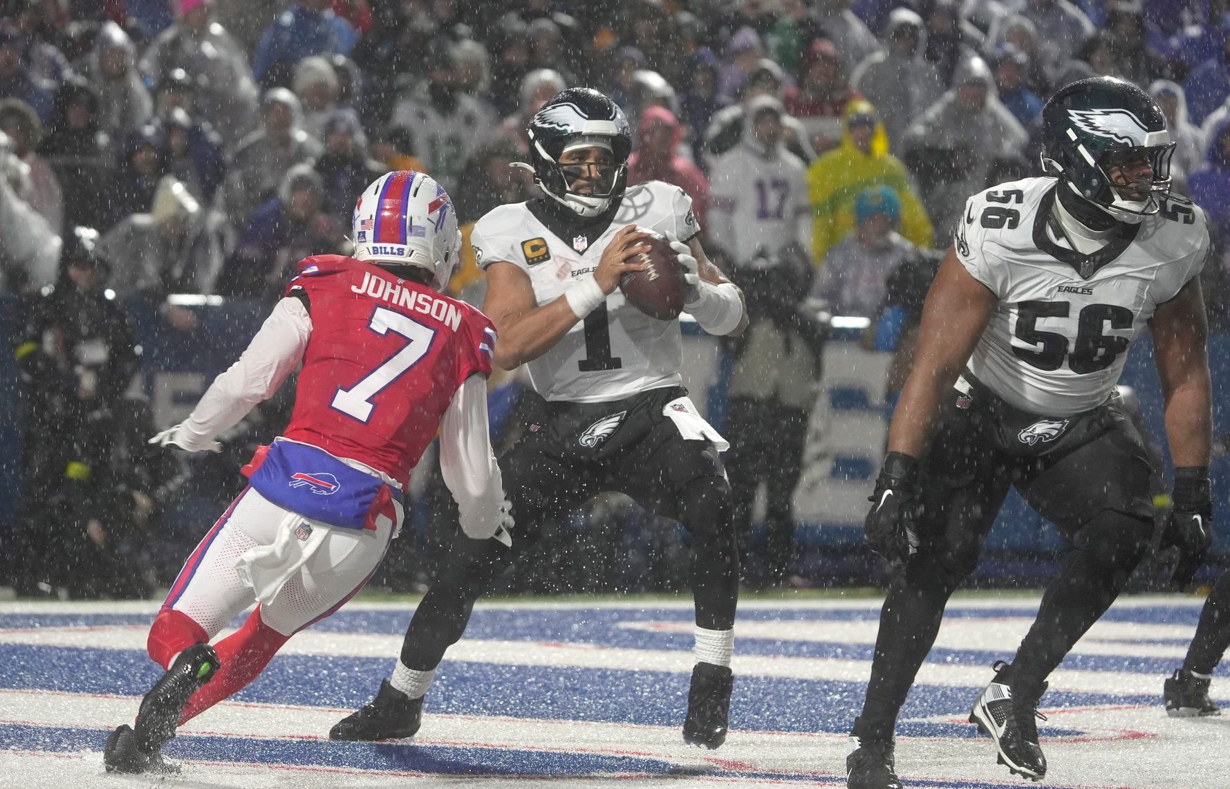 Buffalo Bills cornerback Taron Johnson forces Philadelphia Eagles quarterback Jalen Hurts to scramble away from him during second half action against the Philadelphia Eagles at Highmark Stadium in Orchard Park on Dec. 28, 2025.