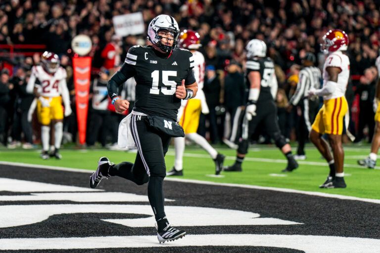 Nebraska Cornhuskers quarterback Dylan Raiola (15) runs off after scoring a touchdown against the Southern California Trojans during the first quarter at Memorial Stadium.