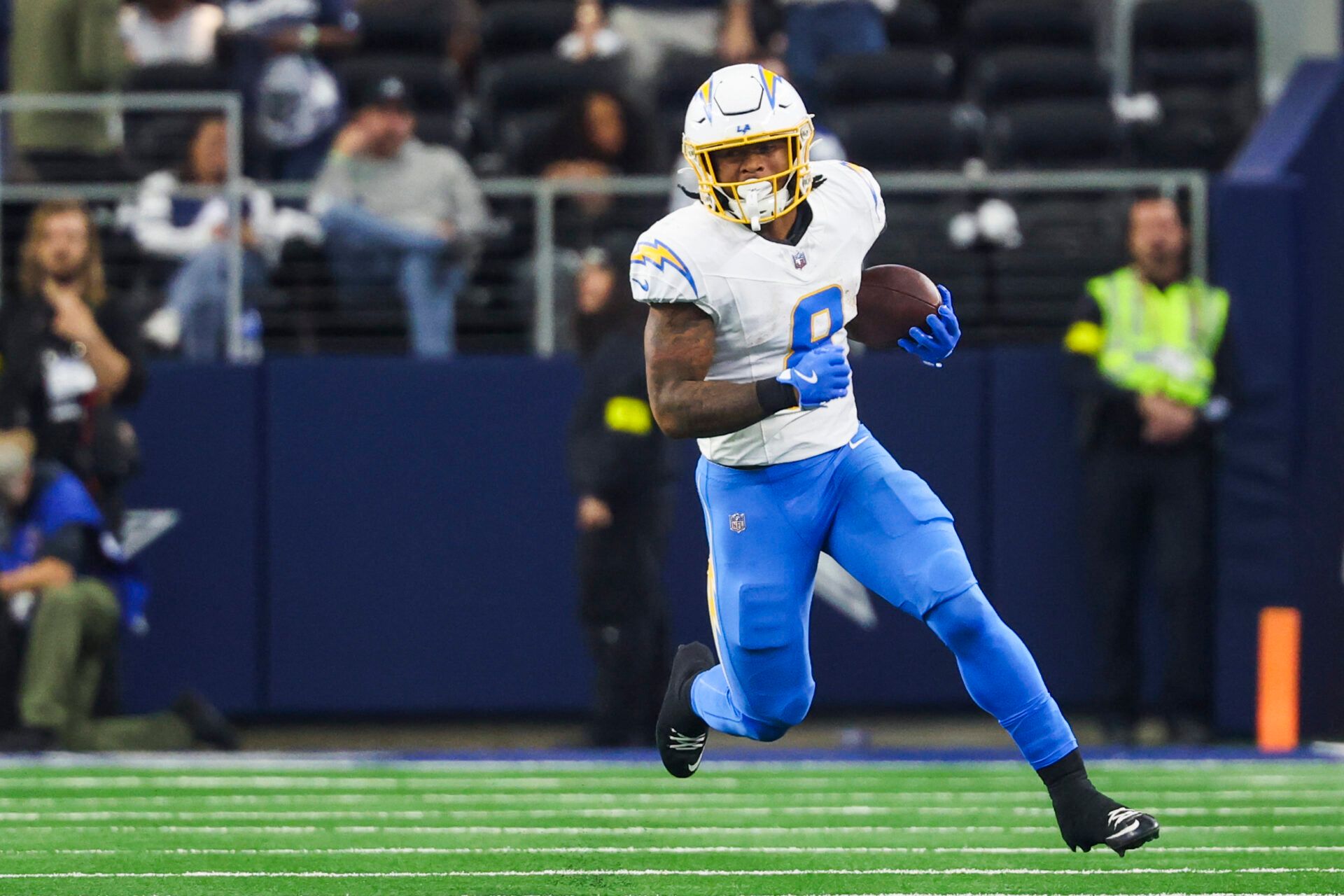 Los Angeles Chargers running back Omarion Hampton (8) rushes against the Dallas Cowboys during the second quarter at AT&T Stadium.
