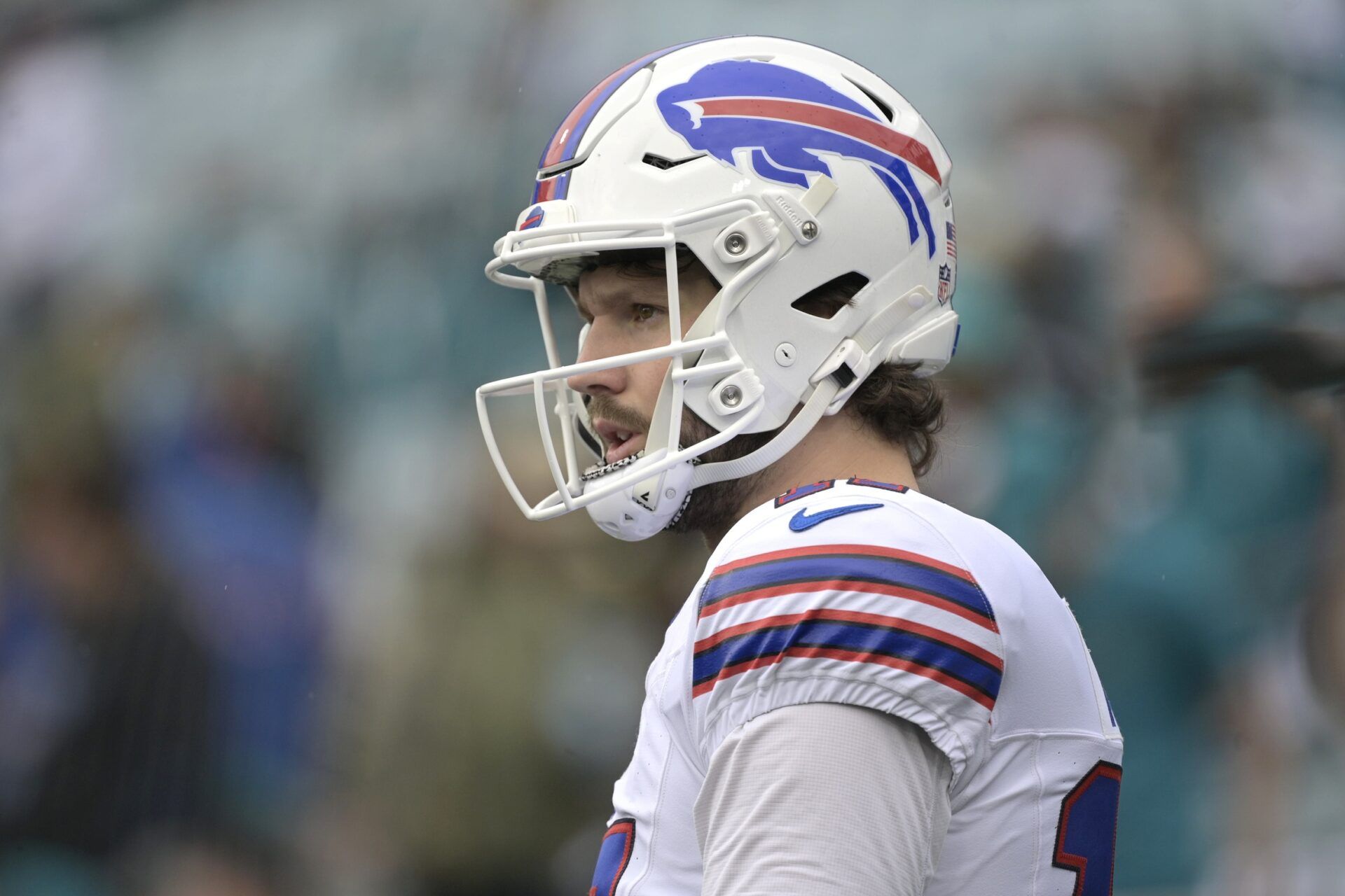 Buffalo Bills quarterback Josh Allen (17) warms up before an AFC Wild Card Round game against the Jacksonville Jaguars at EverBank Stadium.