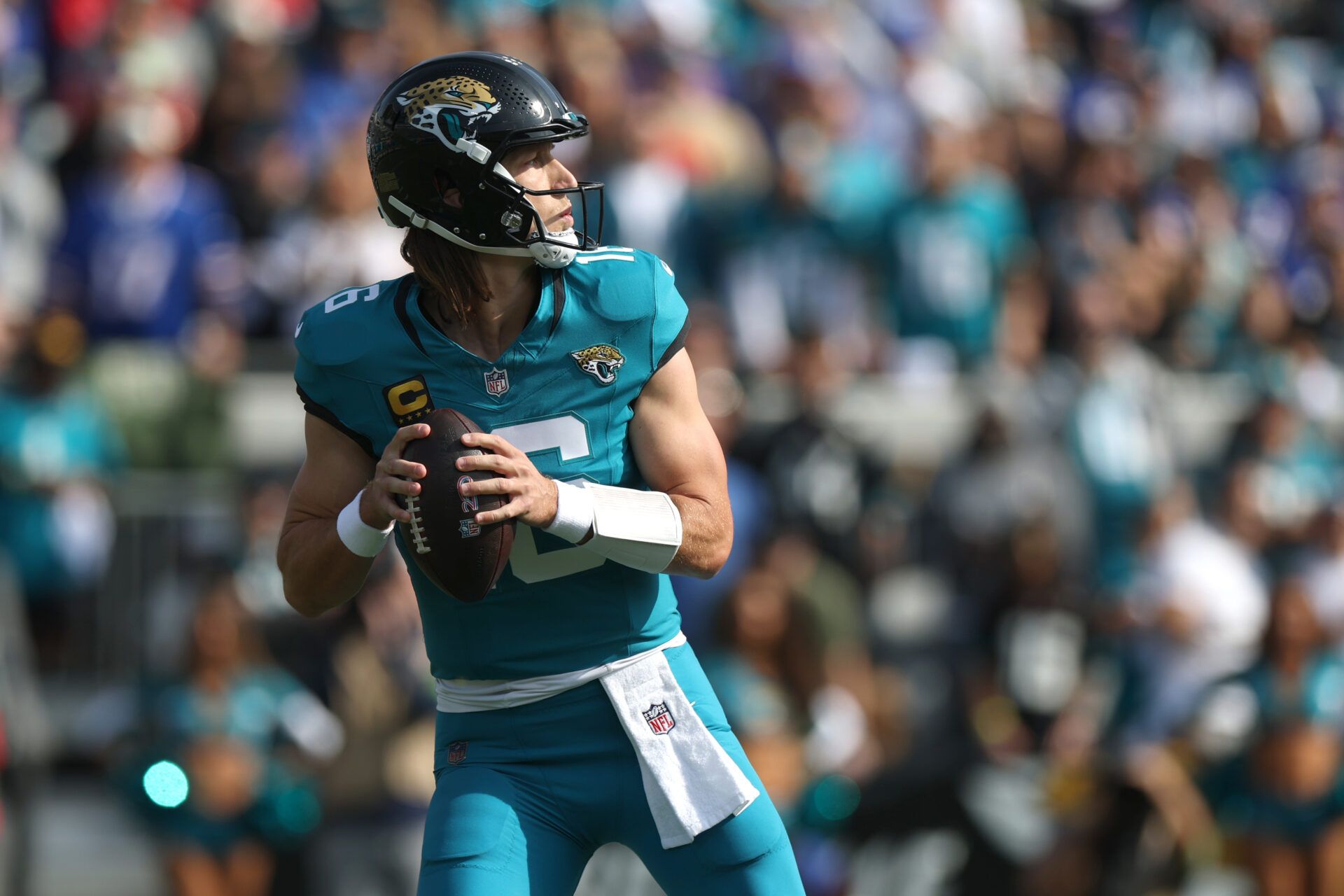 Jacksonville Jaguars quarterback Trevor Lawrence (16) looks to pass the ball during the first half against the Buffalo Bills in an AFC Wild Card Round game at EverBank Stadium.
