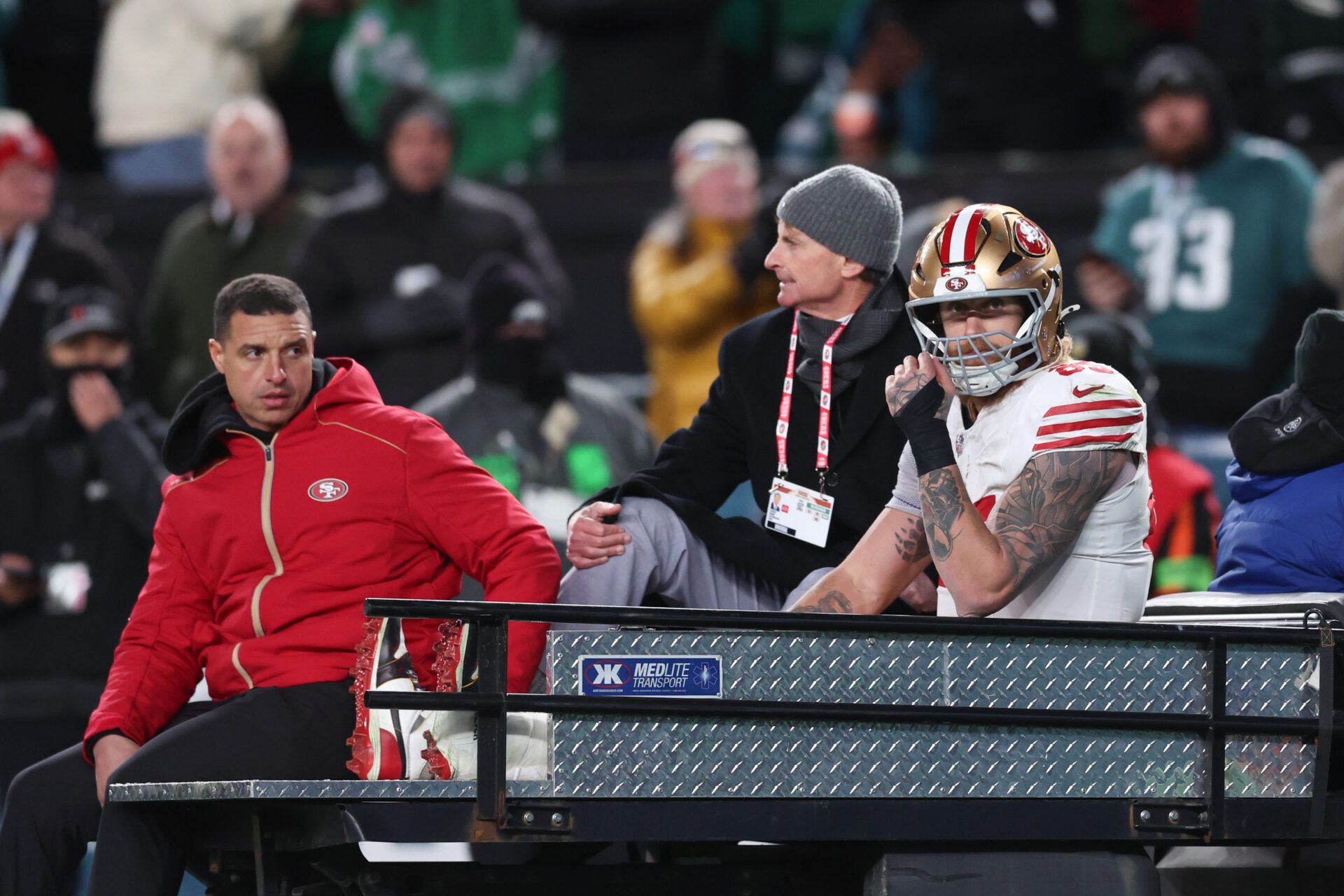 San Francisco 49ers tight end George Kittle (85) is carted off the field after an injury during the second quarter against the Philadelphia Eagles in an NFC Wild Card Round game at Lincoln Financial Field.