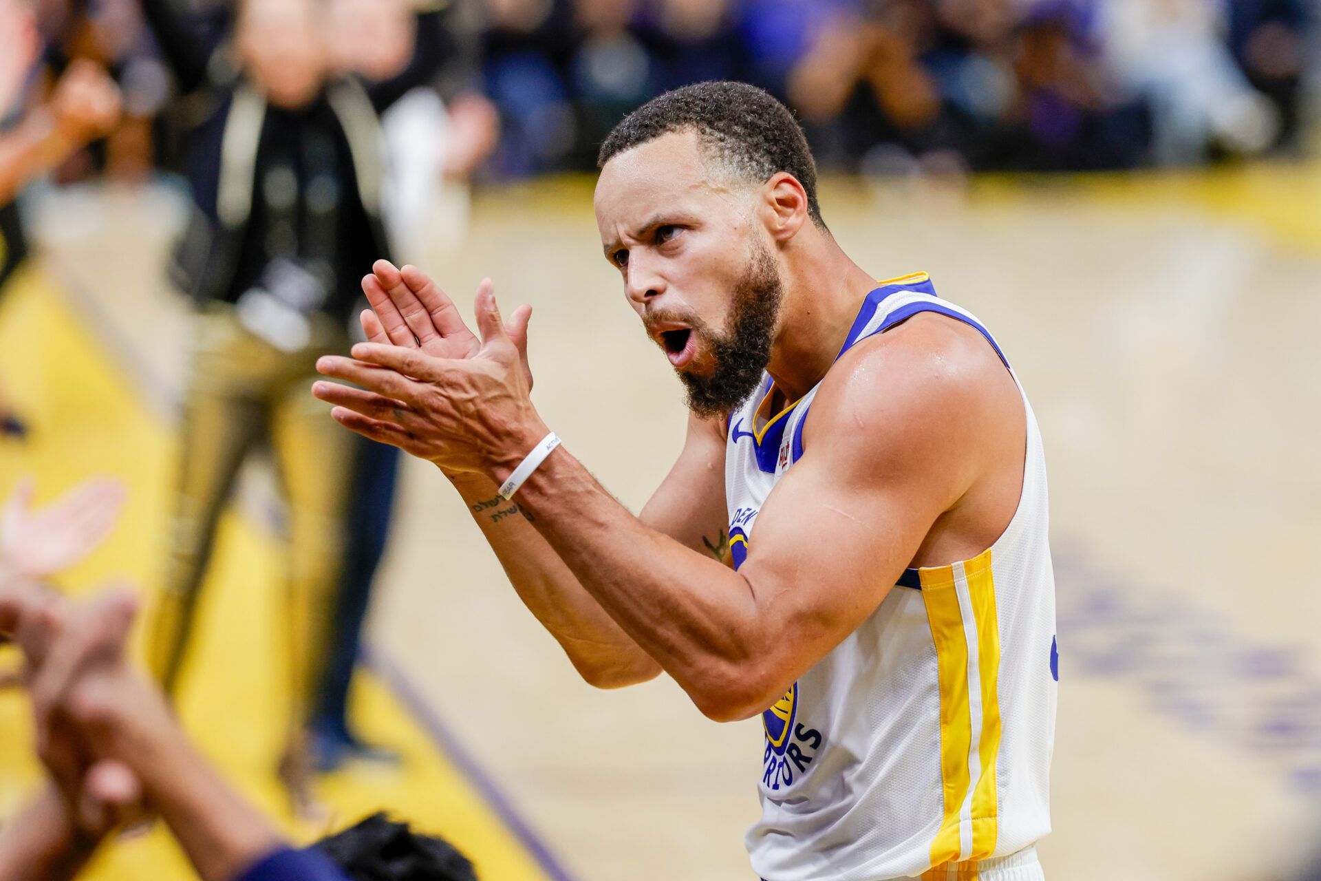 Golden State Warriors guard Stephen Curry (30) celebrates against the Denver Nuggets during the third quarter at Chase Center.