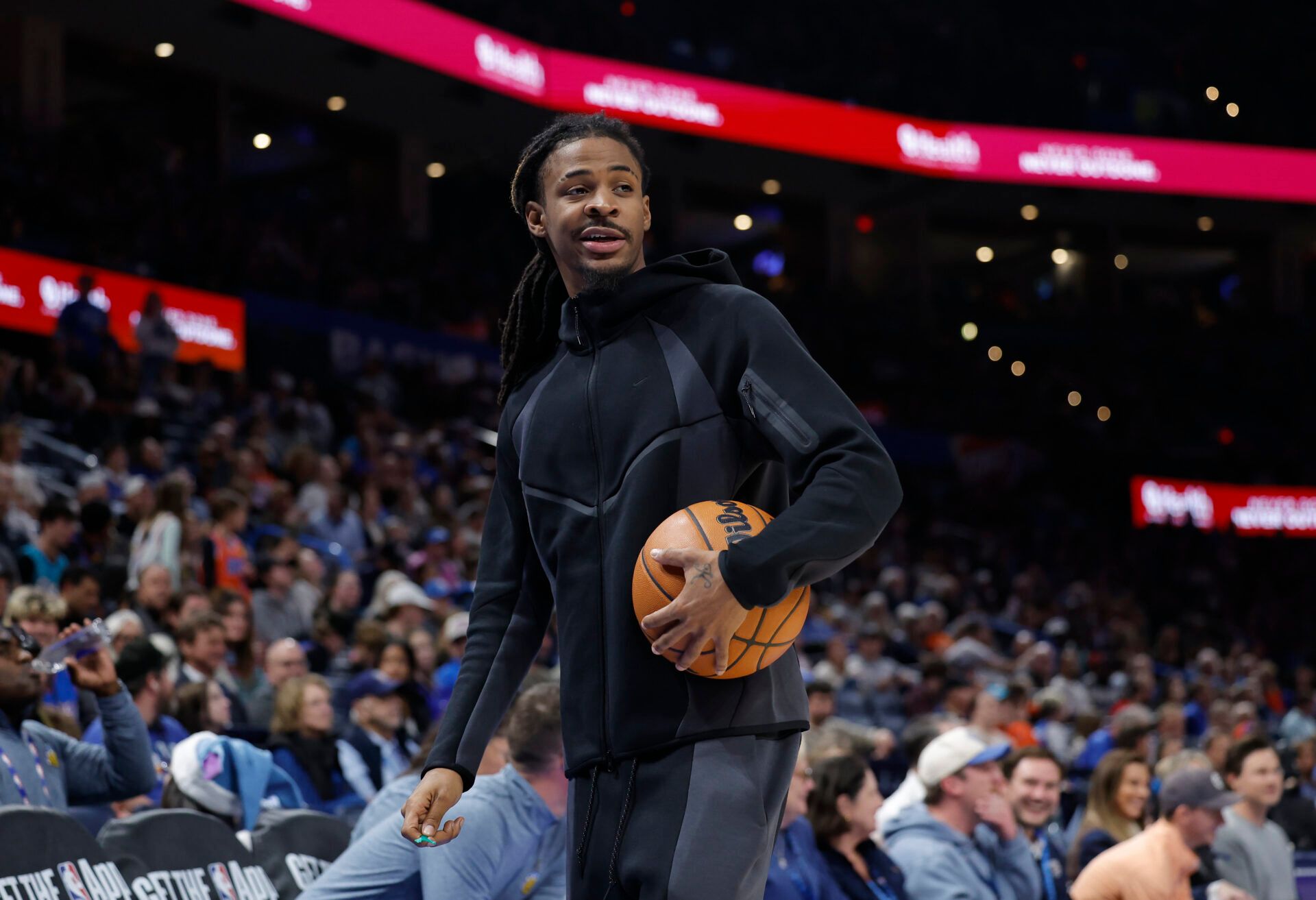 Memphis Grizzlies guard Ja Morant (12) walks off the court during a time out against the Oklahoma City Thunder during the second half at Paycom Center.