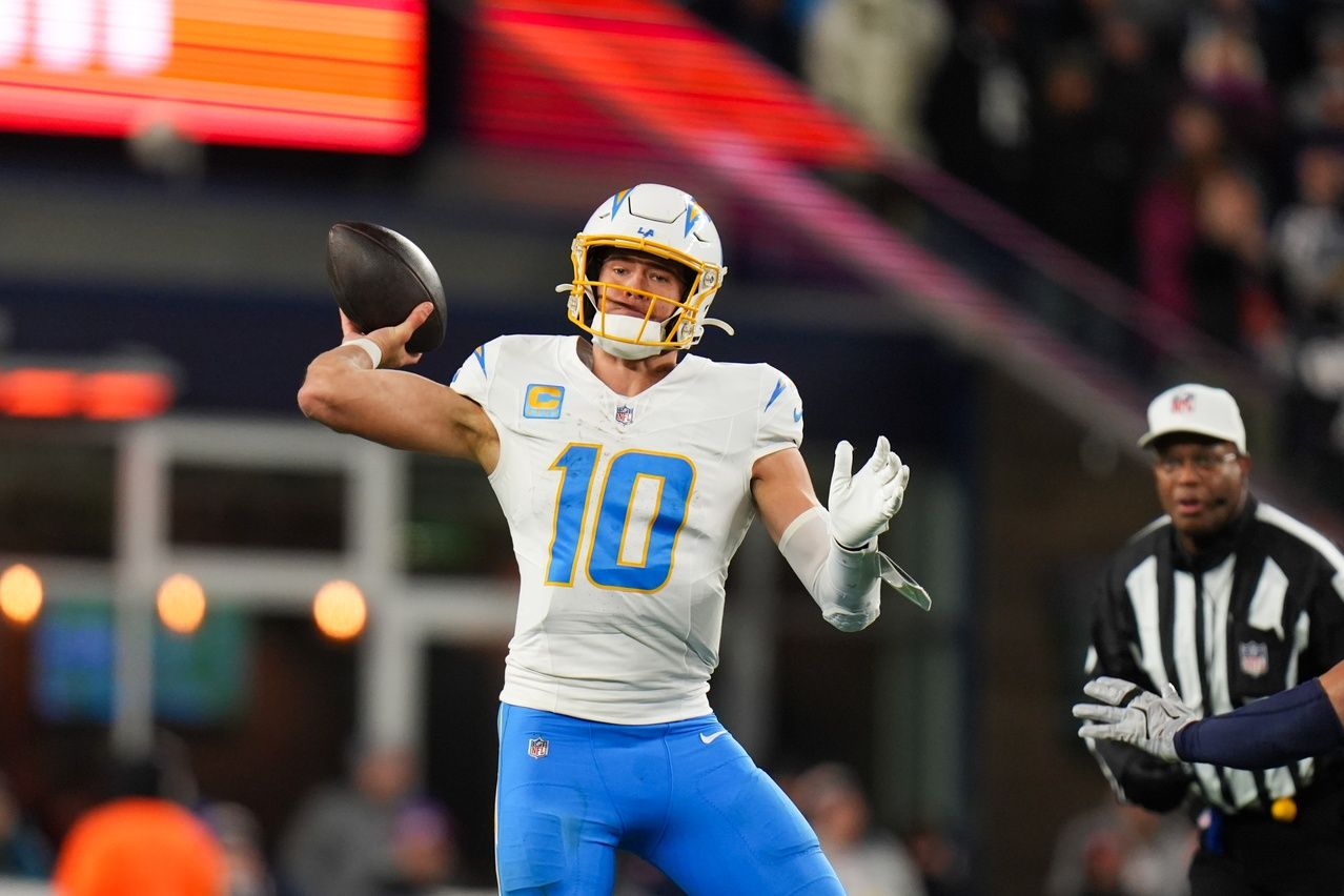 Los Angeles Chargers quarterback Justin Herbert (10) throws a pass during the third quarter against the New England Patriots in an AFC Wild Card Round game at Gillette Stadium.