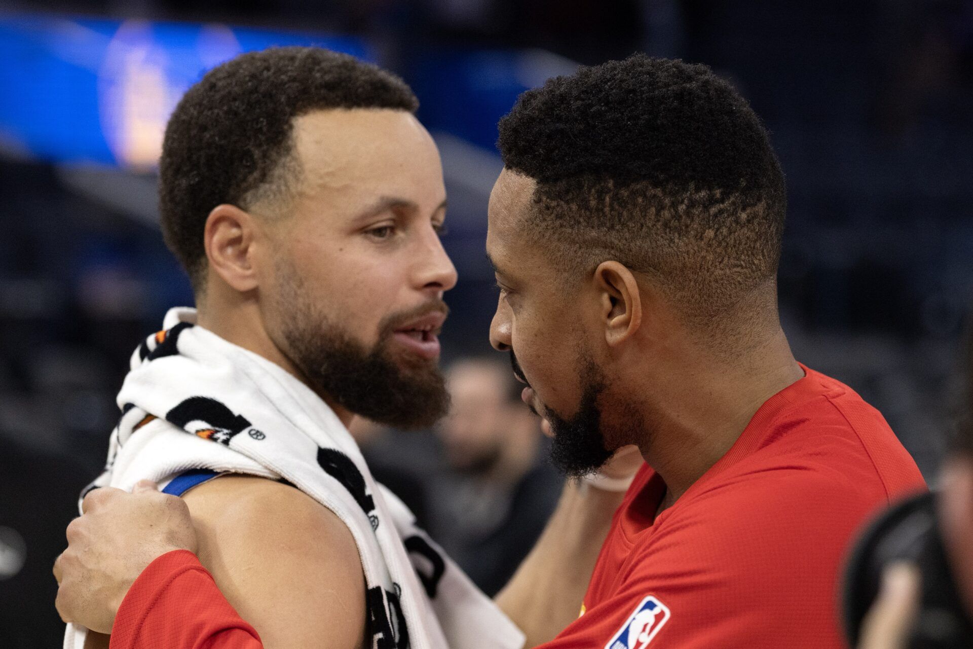 Golden State Warriors guard Stephen Curry (left) greets Atlanta Hawks guard CJ McCollum following their game at Chase Center.