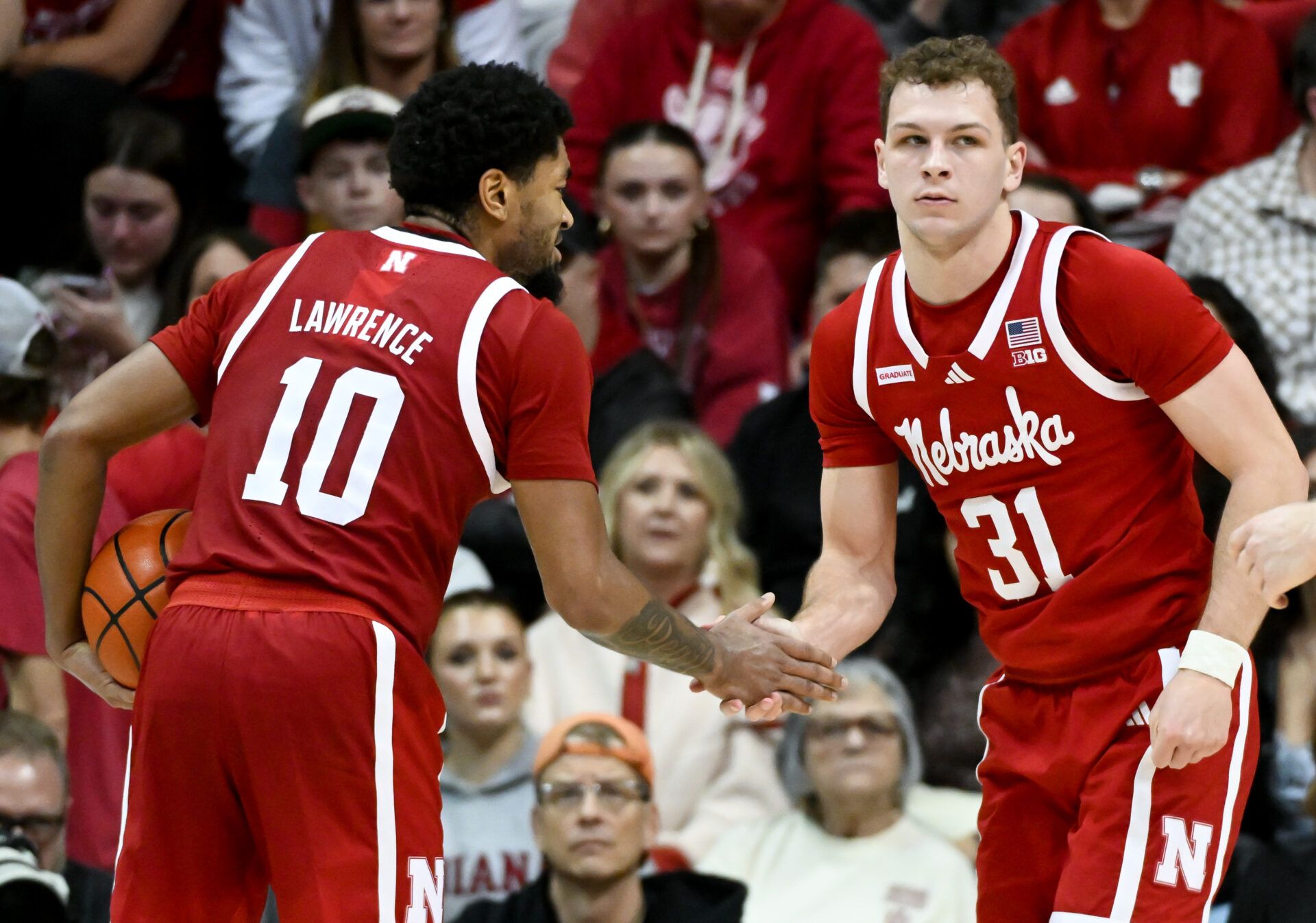 Nebraska Cornhuskers guard Jamarques Lawrence (10) and Nebraska Cornhuskers guard Cale Jacobsen (31) celebrate after a play against the Indiana Hoosiers during the second half at Simon Skjodt Assembly Hall.