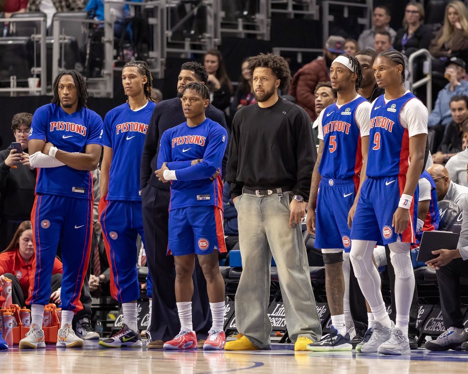 Detroit Pistons guard Cade Cunningham (2) and the rest of the team watch form the bench late in the fourth quarter against the LA Clippers at Little Caesars Arena.
