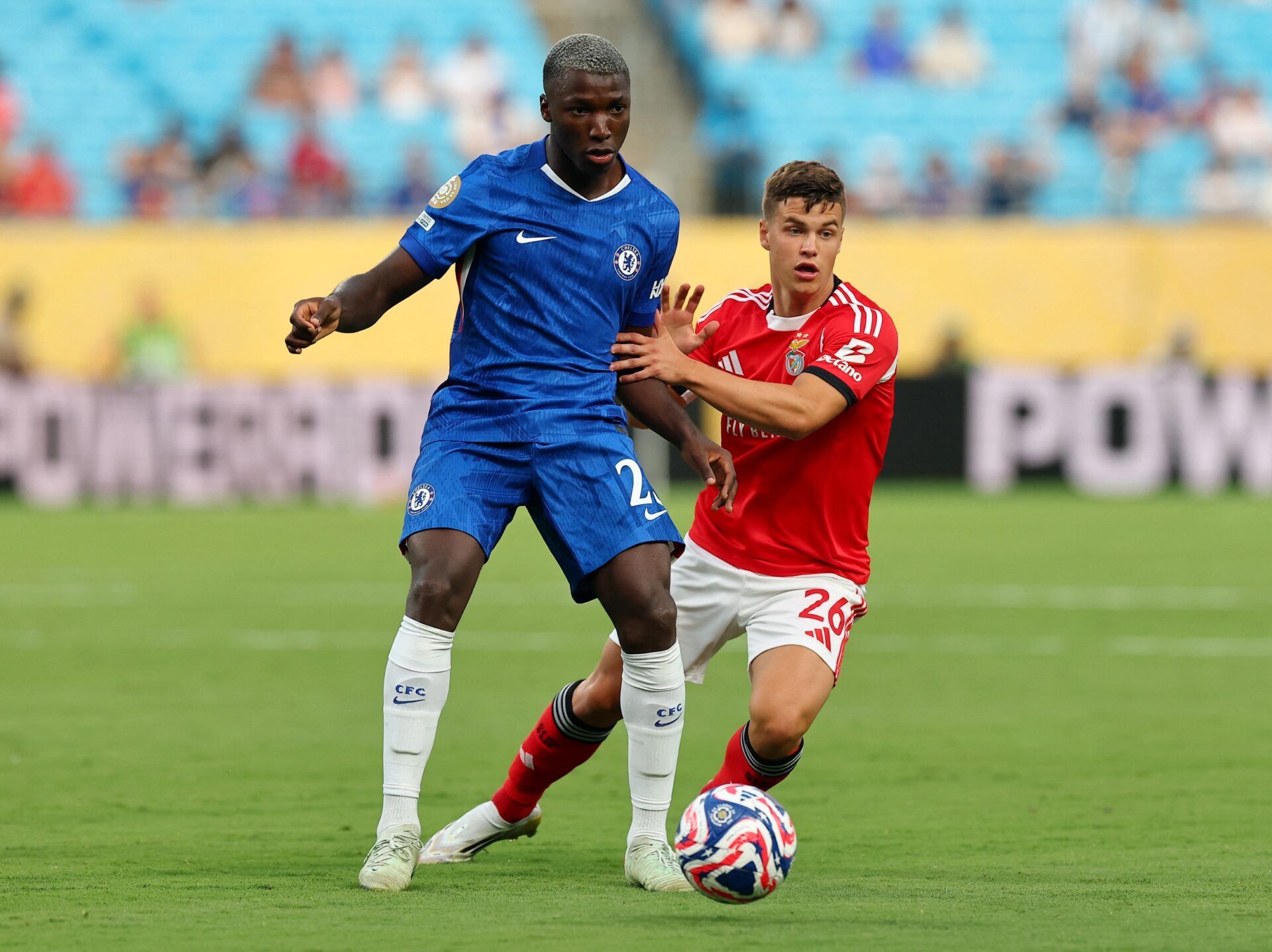 [Subscription Customers Only] Jun 28, 2025; Charlotte, North Carolina, USA; Chelsea FC midfielder Moises Caicedo (25) in action with SL Benfica defender Samuel Dahl (26) during a round of 16 match of the 2025 FIFA Club World Cup at Bank of America Stadium.