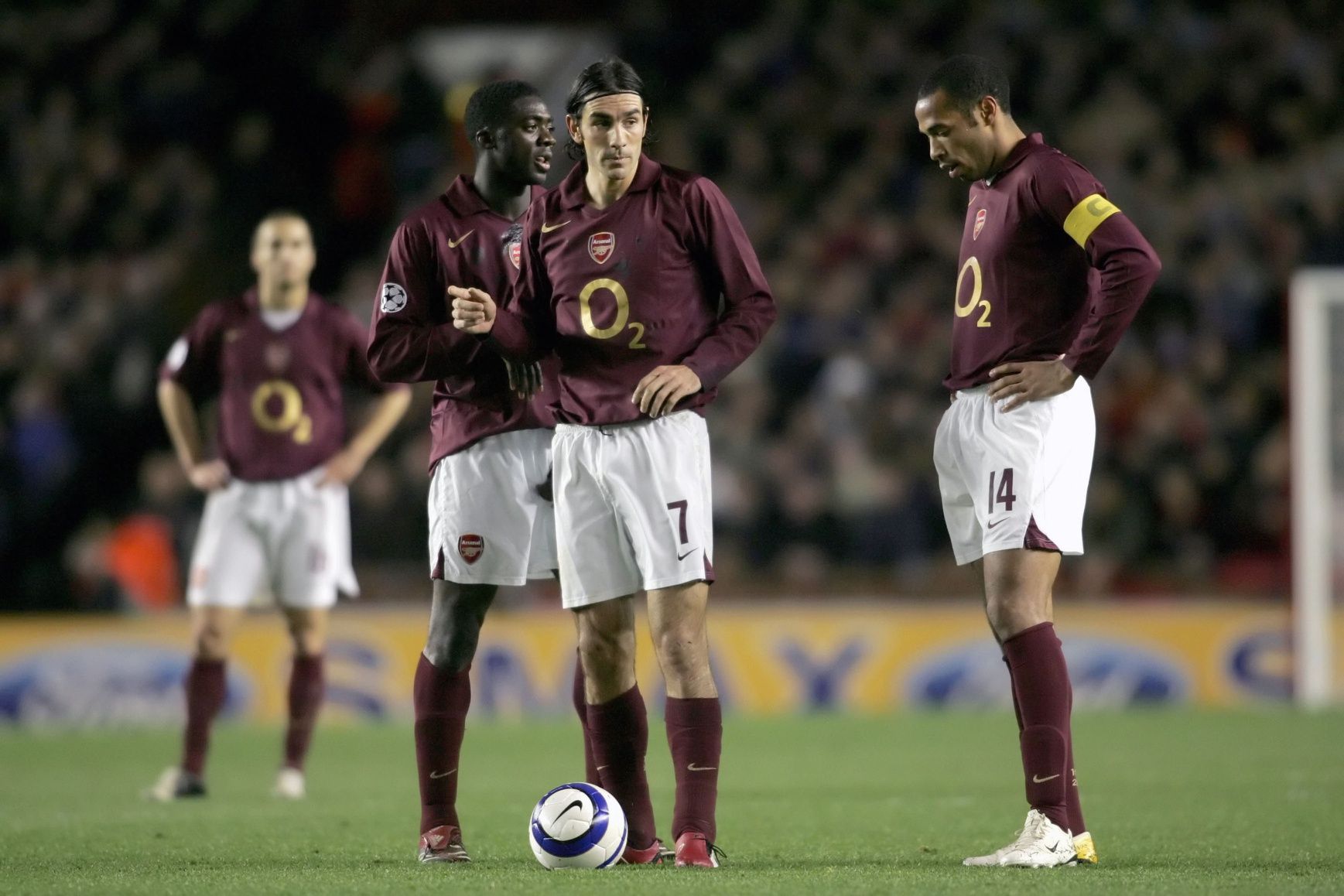 Champions League ; Arsenal players Emmanuel Adebayor (left), (7) Robert Pires and (14) Thierry Henry wait to put the ball in play during a match against Juventus at Highland Stadium in London, England. Arsenal won the game 2-0.