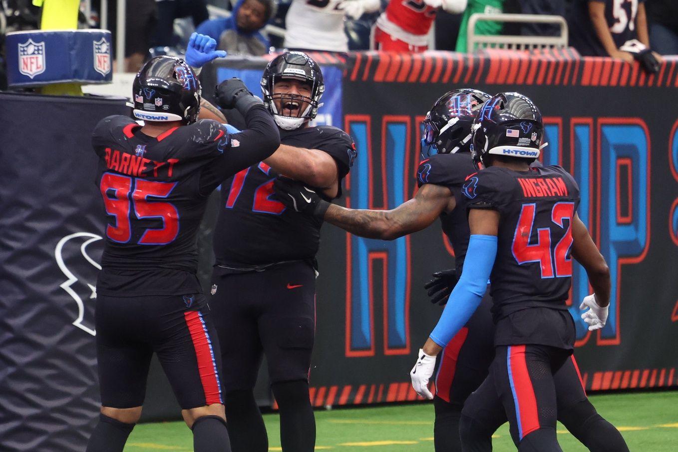 Houston Texans defensive tackle Tommy Togiai (72) celebrates with teammates after recovering a fumble for a touchdown against the Indianapolis Colts during the second half at NRG Stadium.