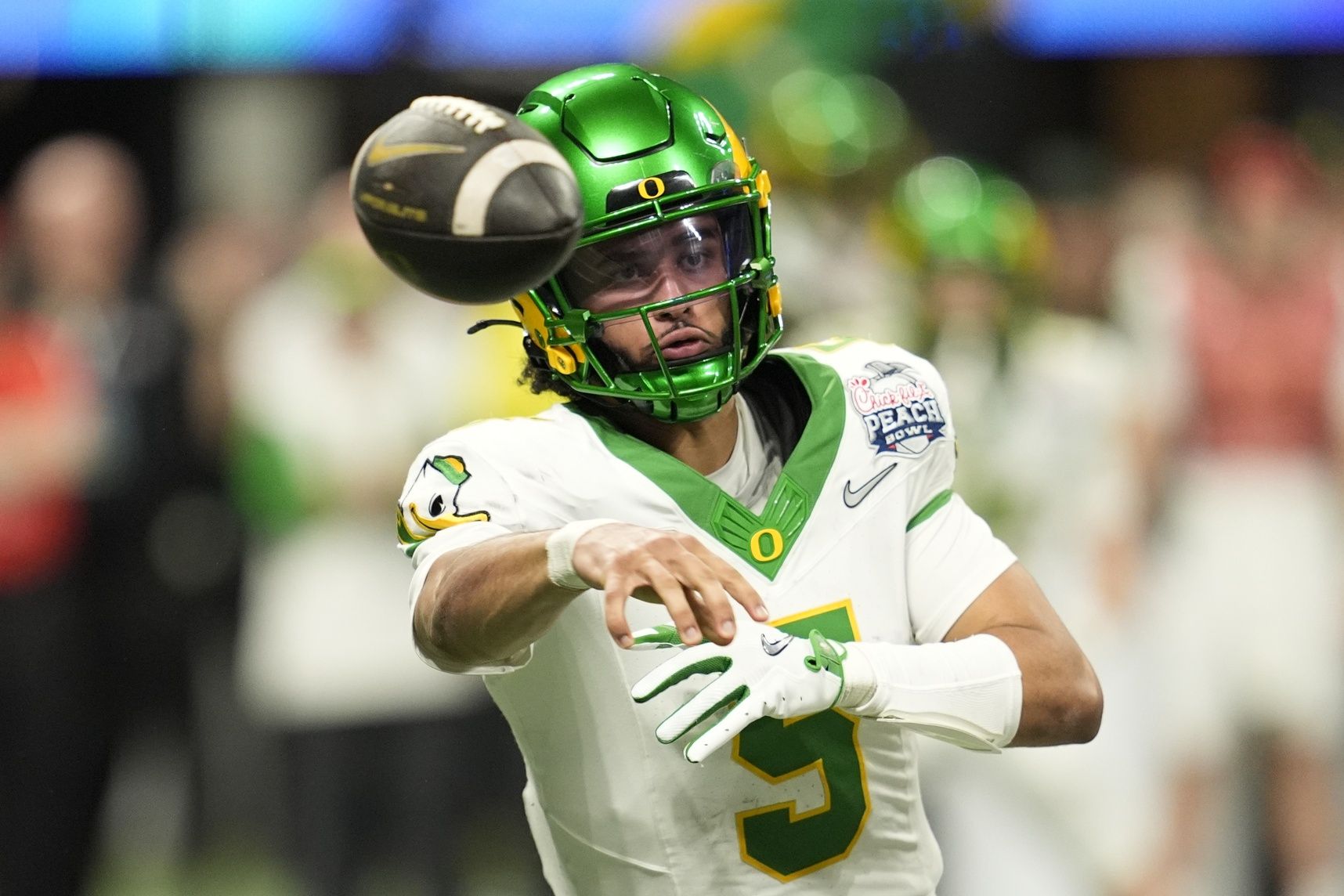 Oregon Ducks quarterback Dante Moore (5) throws a pass during the fourth quarter the 2025 Peach Bowl and semifinal game of the College Football Playoff at Mercedes-Benz Stadium.