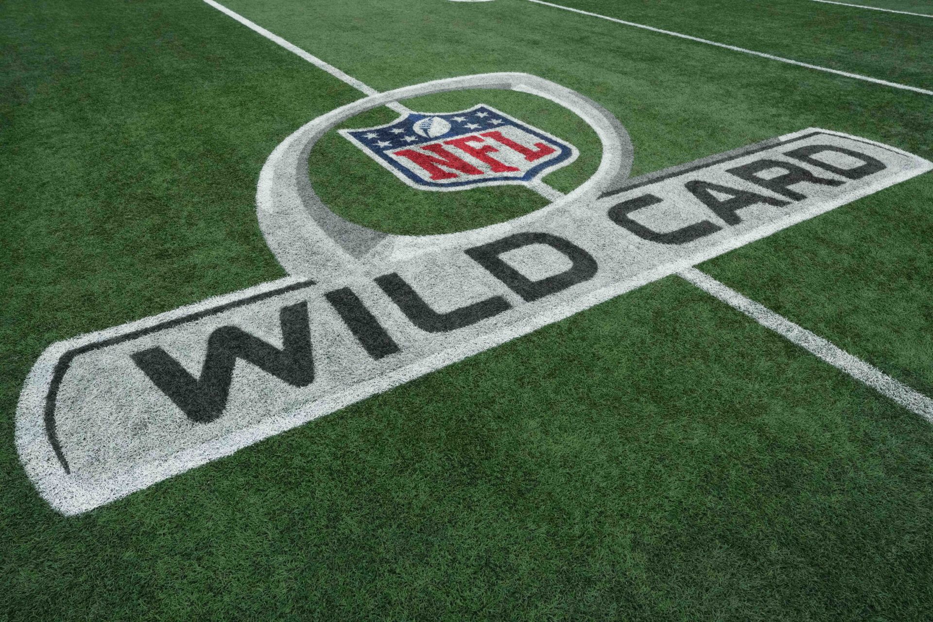 The NFL Wild Card logo on the field prior to the 2026 NFC wild card playoff football game between the Los Angeles Rams and the Carolina Panthers at Bank of America Stadium.