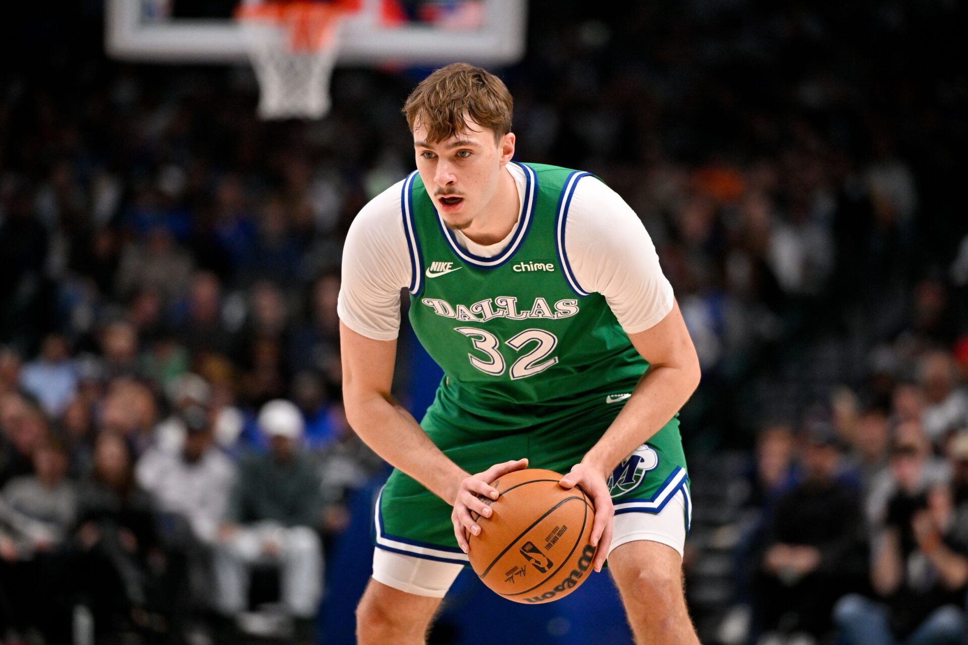 Dallas Mavericks forward Cooper Flagg (32) looks to move the ball against the Brooklyn Nets during the second quarter at the American Airlines Center.