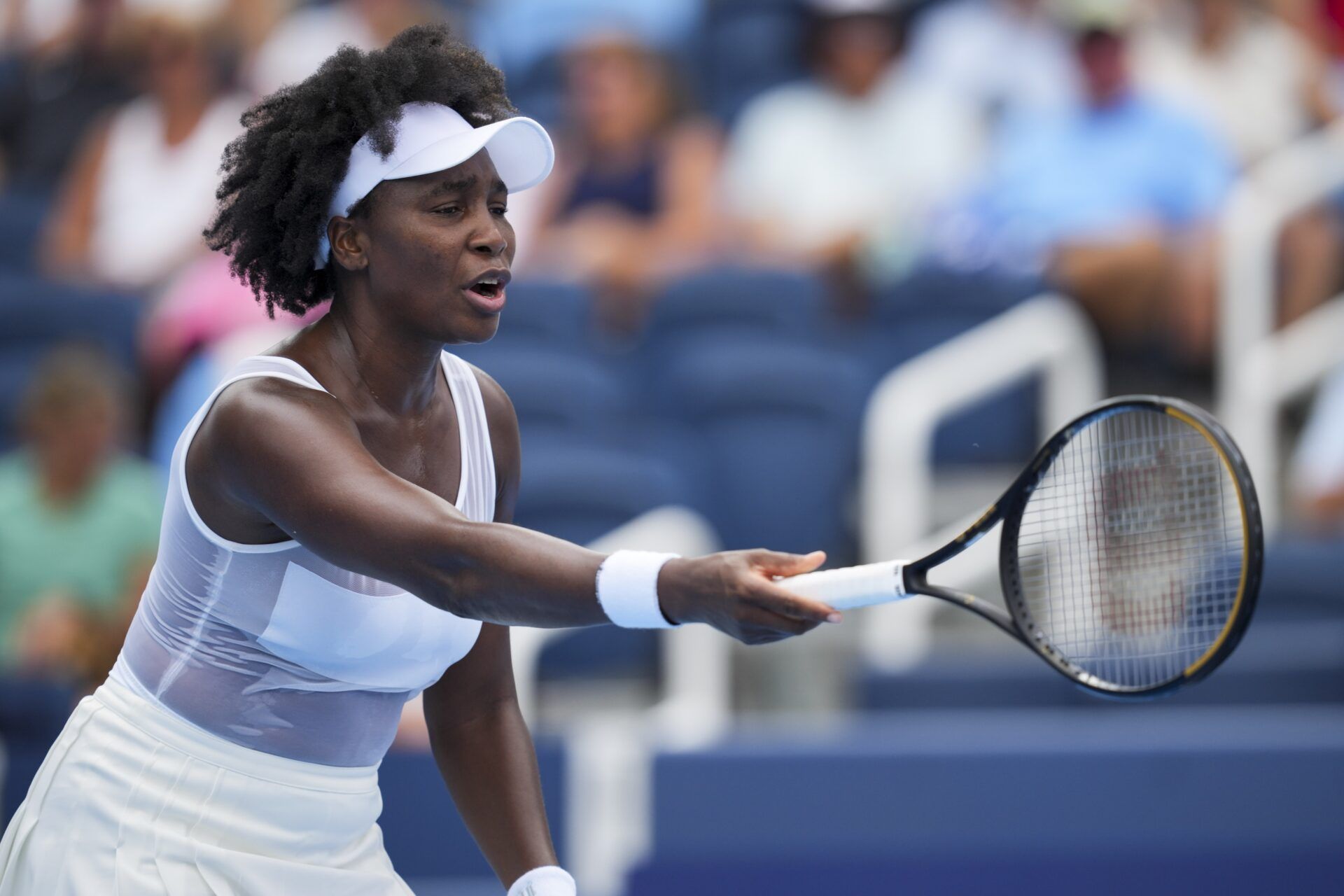Venus Williams (USA) reacts after returning a shot against Jessica Bouzas Maneiro (ESP) during the Cincinnati Open at the Lindner Family Tennis Center.