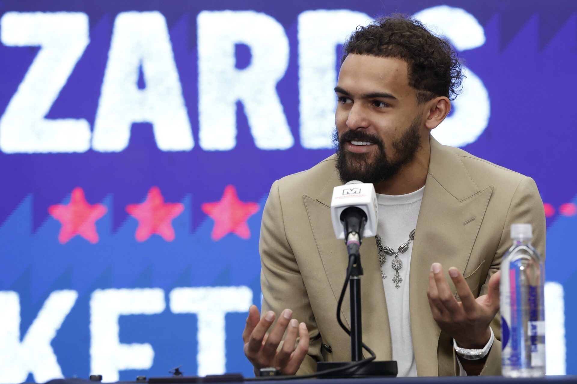 Newly acquired Washington Wizards guard Trae Young speaks at an introductory press conference prior to the Wizards' game against the New Orleans Pelicans at Capital One Arena.