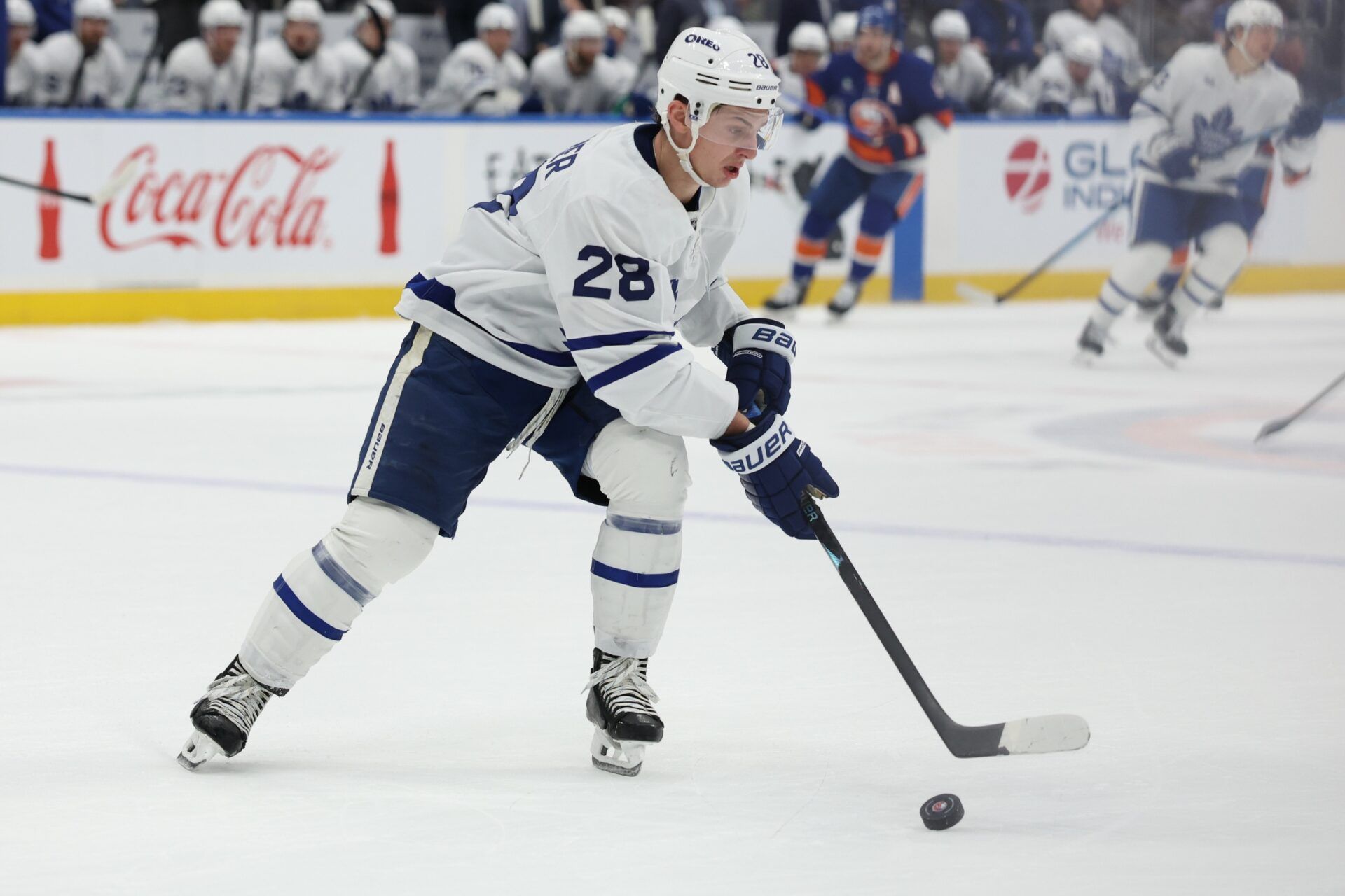 Toronto Maple Leafs defenseman Troy Stecher (28) moves the puck against the New York Islanders during the second period at UBS Arena.