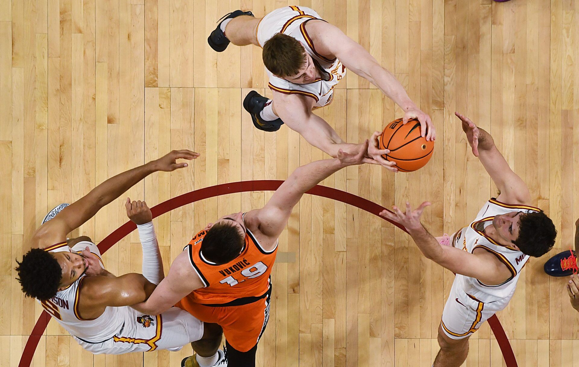 Iowa State Cyclones forward Dominykas Pleta (21) and forward Milan Momcilovic (22) attempt for a rebound around Oklahoma State Cowboys forward Andrija Vukovic (19) during the second half in the Big-12 men’s basketball on Jan. 10, 2026, at Hilton Coliseum in Ames, Iowa.