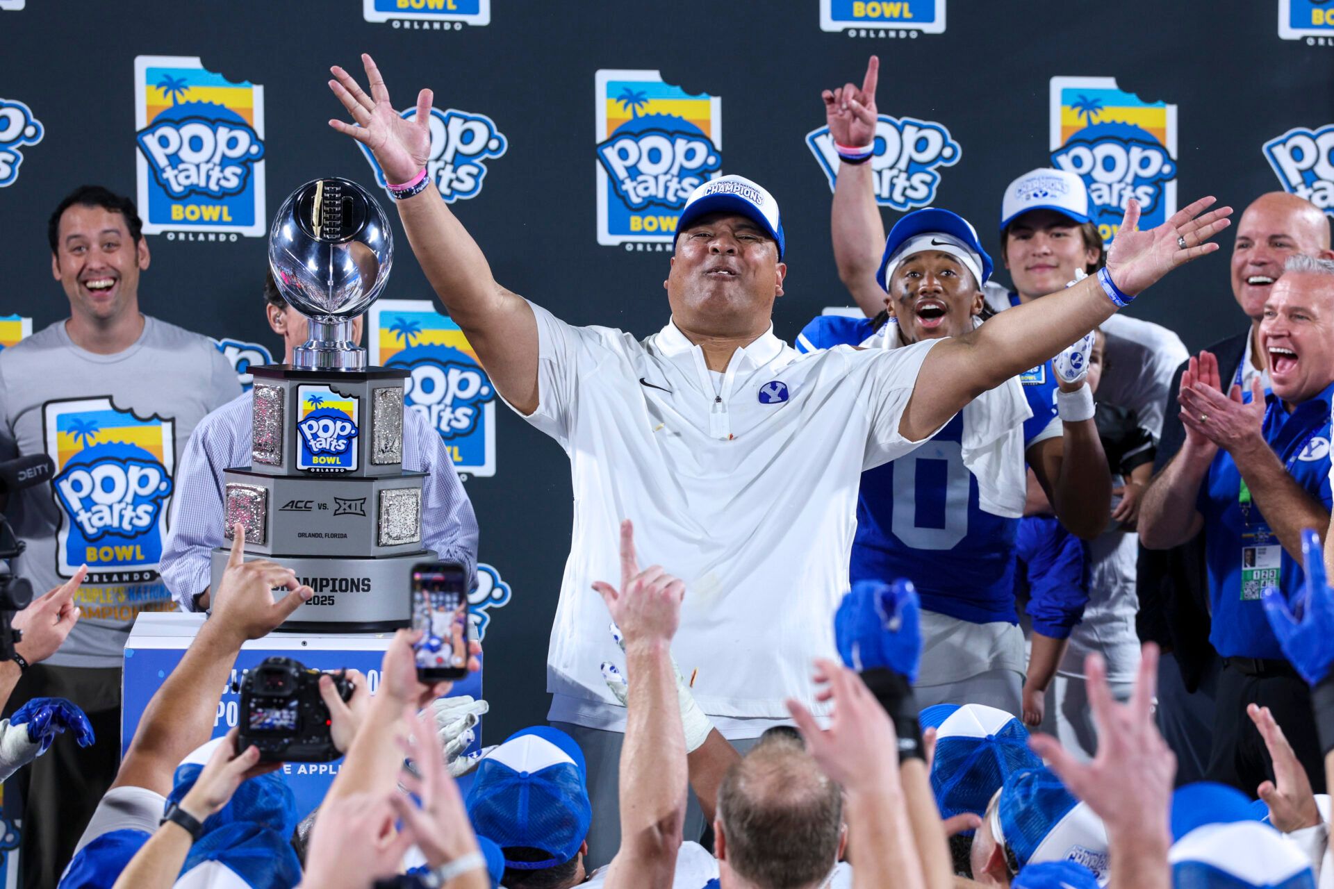 BYU Cougars head coach Kalani Sitake celebrates after beating Georgia Tech Yellow Jackets in the Pop-Tarts Bowl at Camping World Stadium.