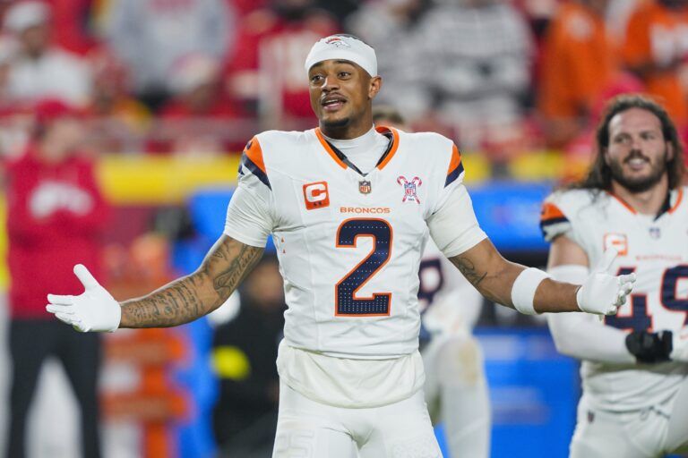 Denver Broncos cornerback Pat Surtain II (2) warms up prior to a game against the Kansas City Chiefs at GEHA Field at Arrowhead Stadium.